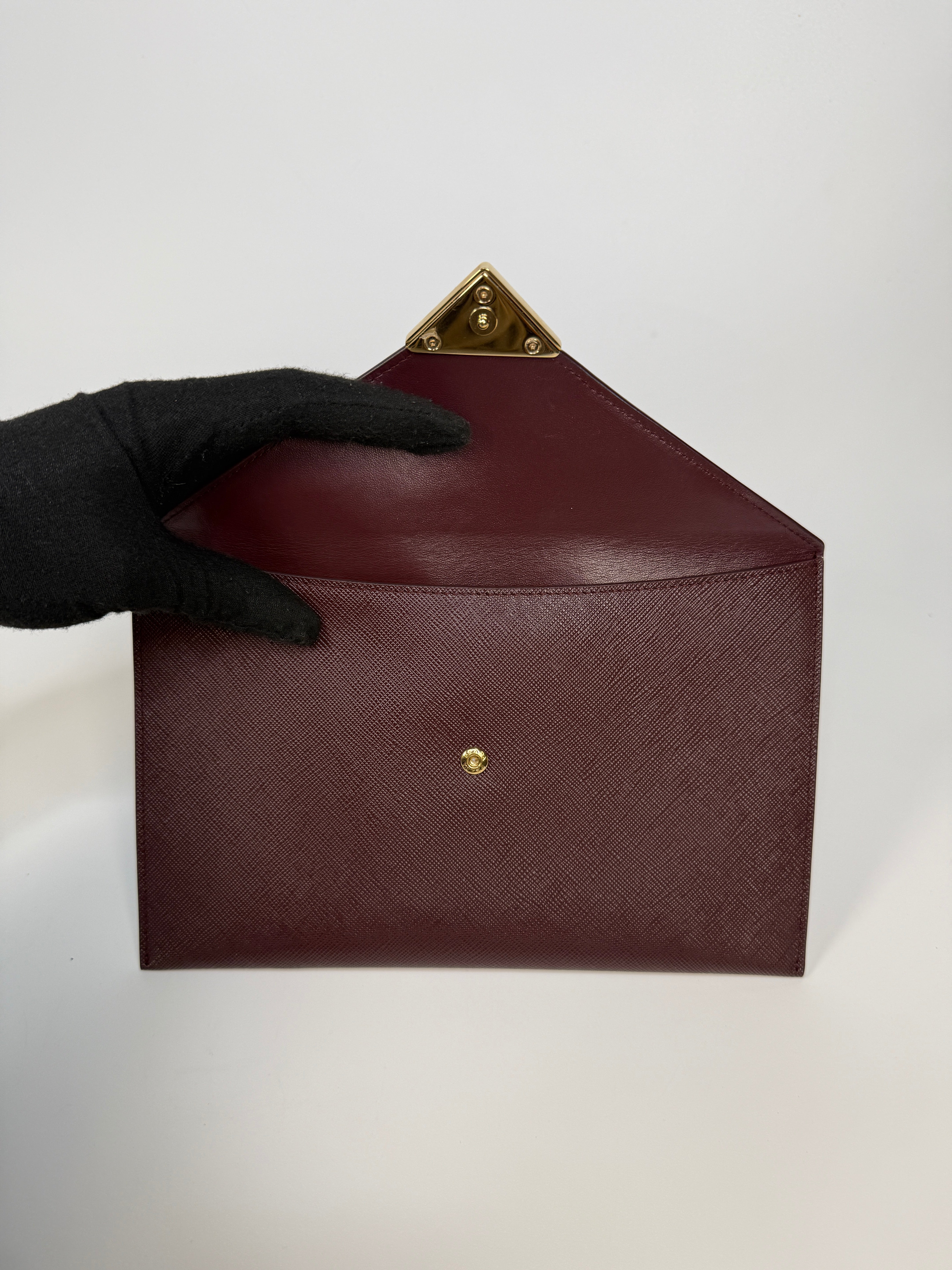 Prada Clutch In Burgundy Saffiano Leather With Gold Hardware