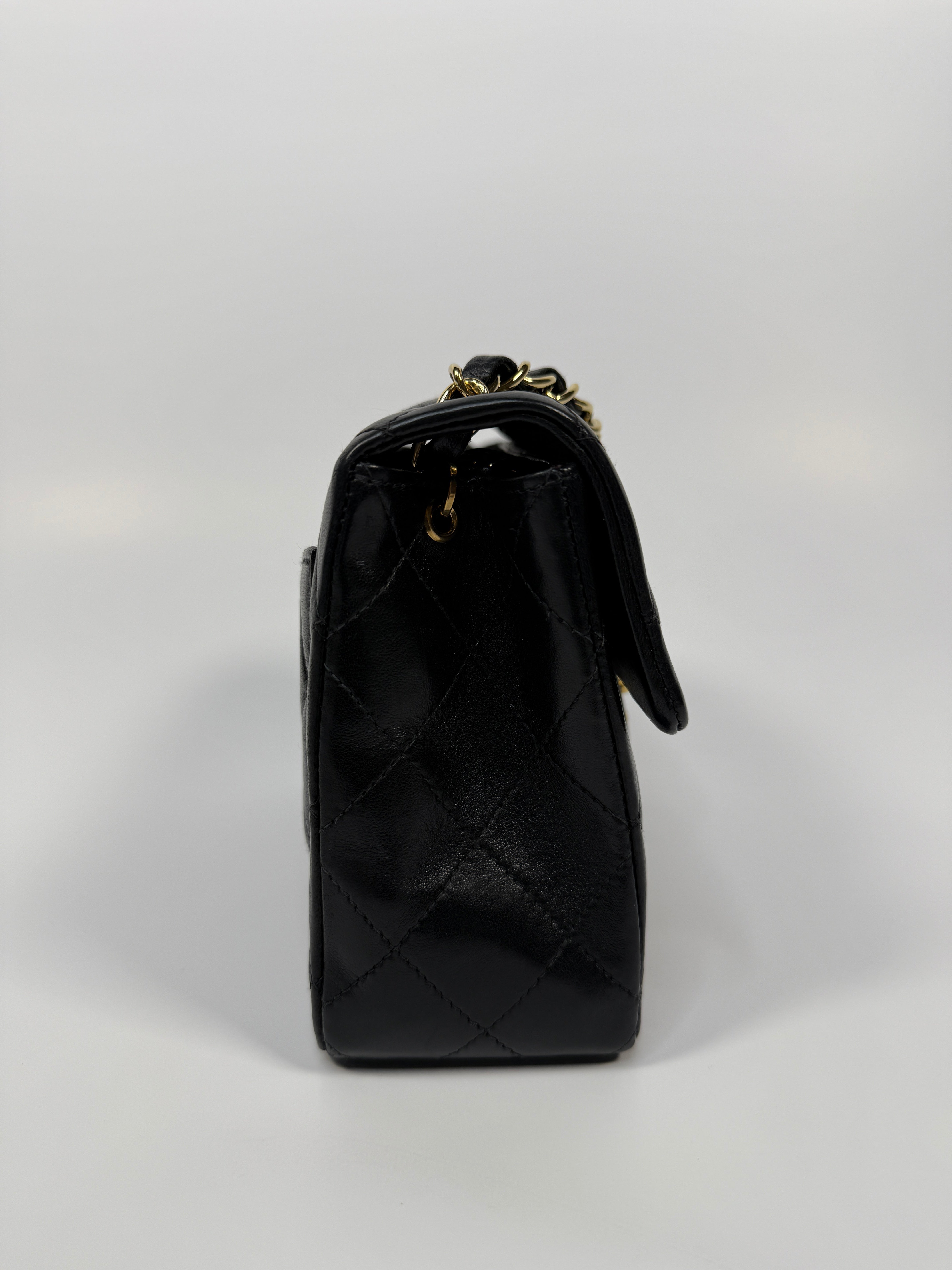 Chanel Black Square Vintage Flap Bag In Lambskin With Gold Hardware
Pre Loved & Authentic 