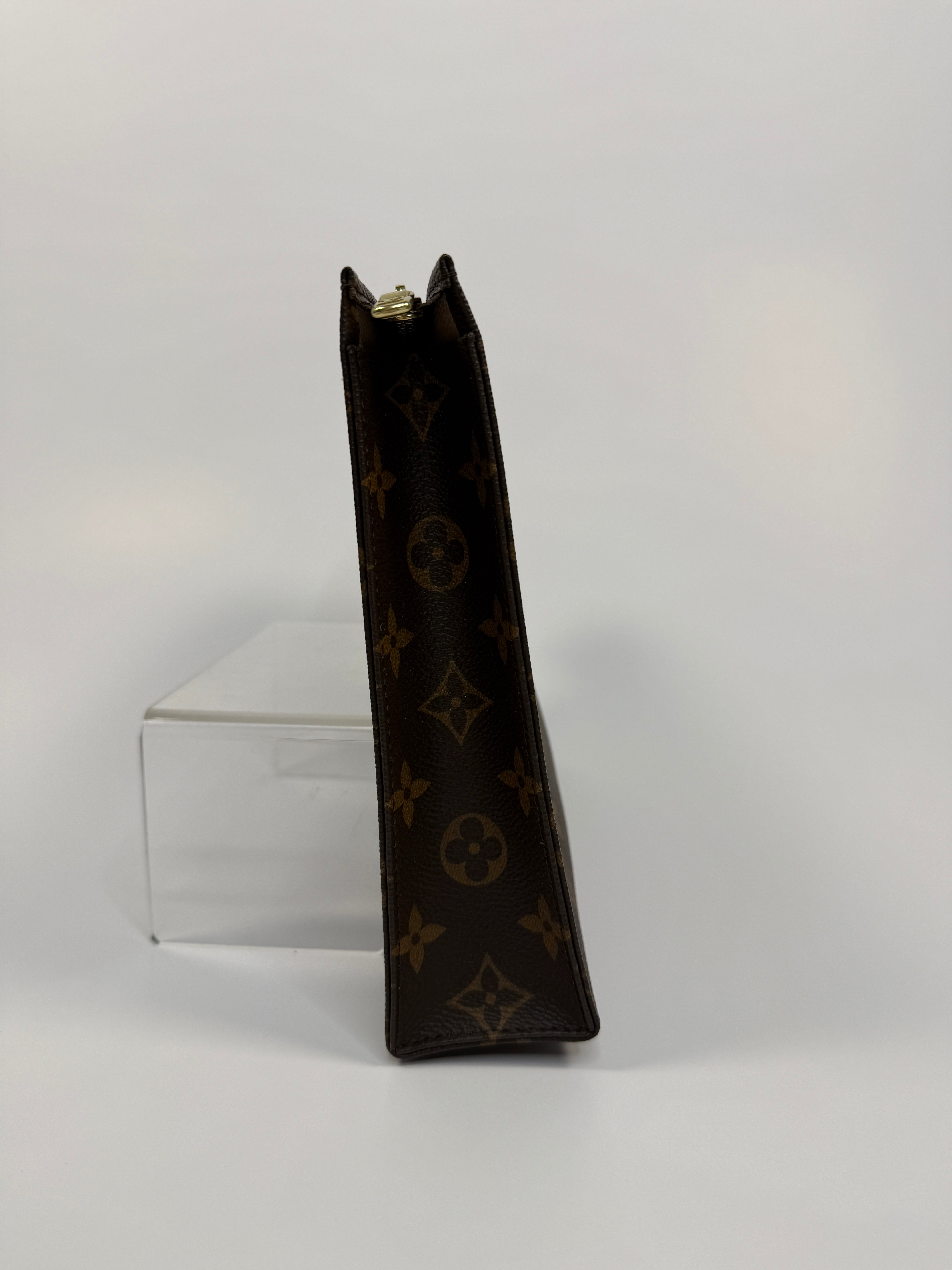 Authentic and preloved Louis Vuitton Monogram Toiletry 26 Pouch In Brown Monogram With Gold Hardware in excellent condition