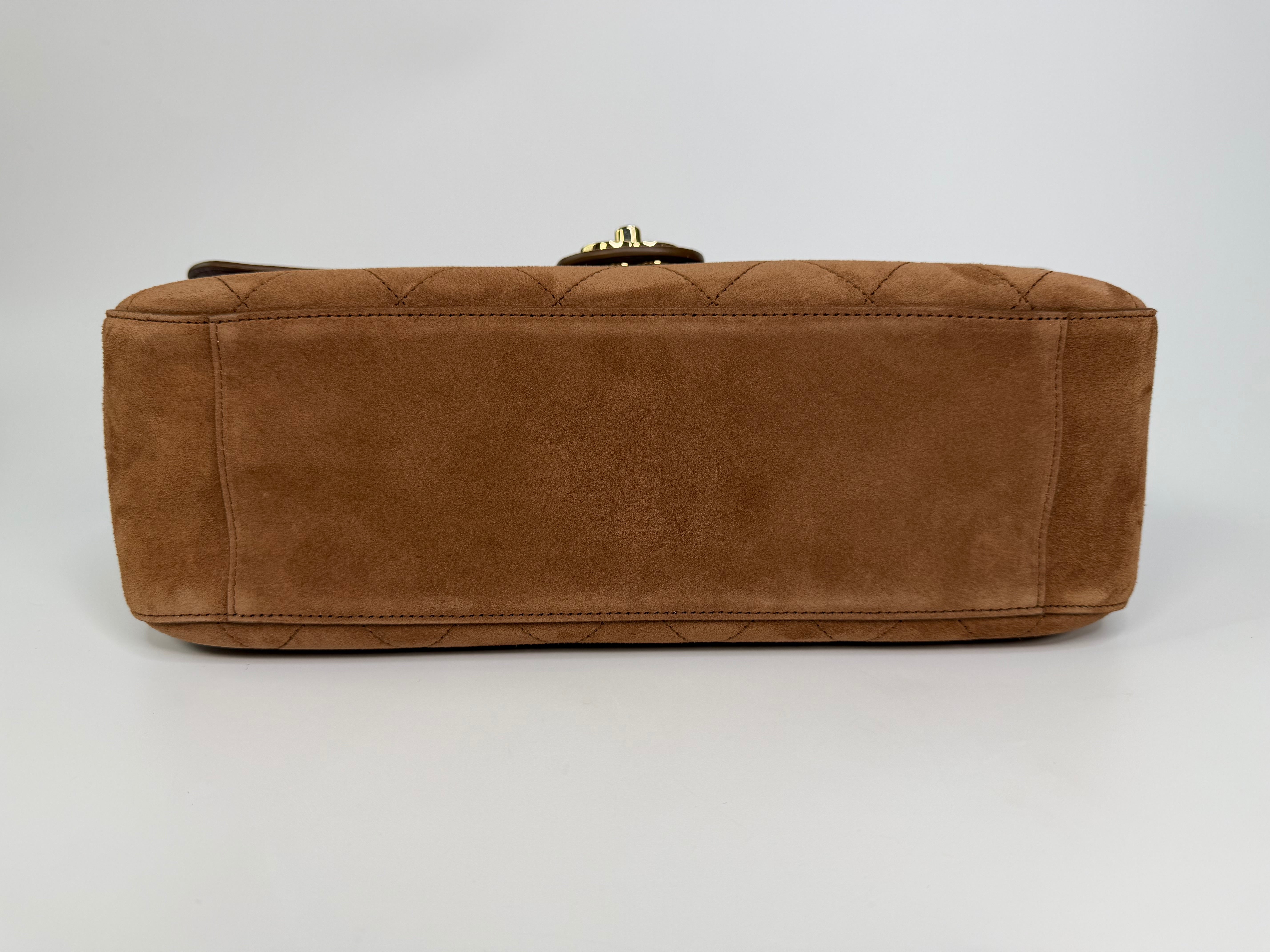 Chanel Maxi Flap In Tan Suede With Gold Hardware. Authentic and preloved in new and unused condition.