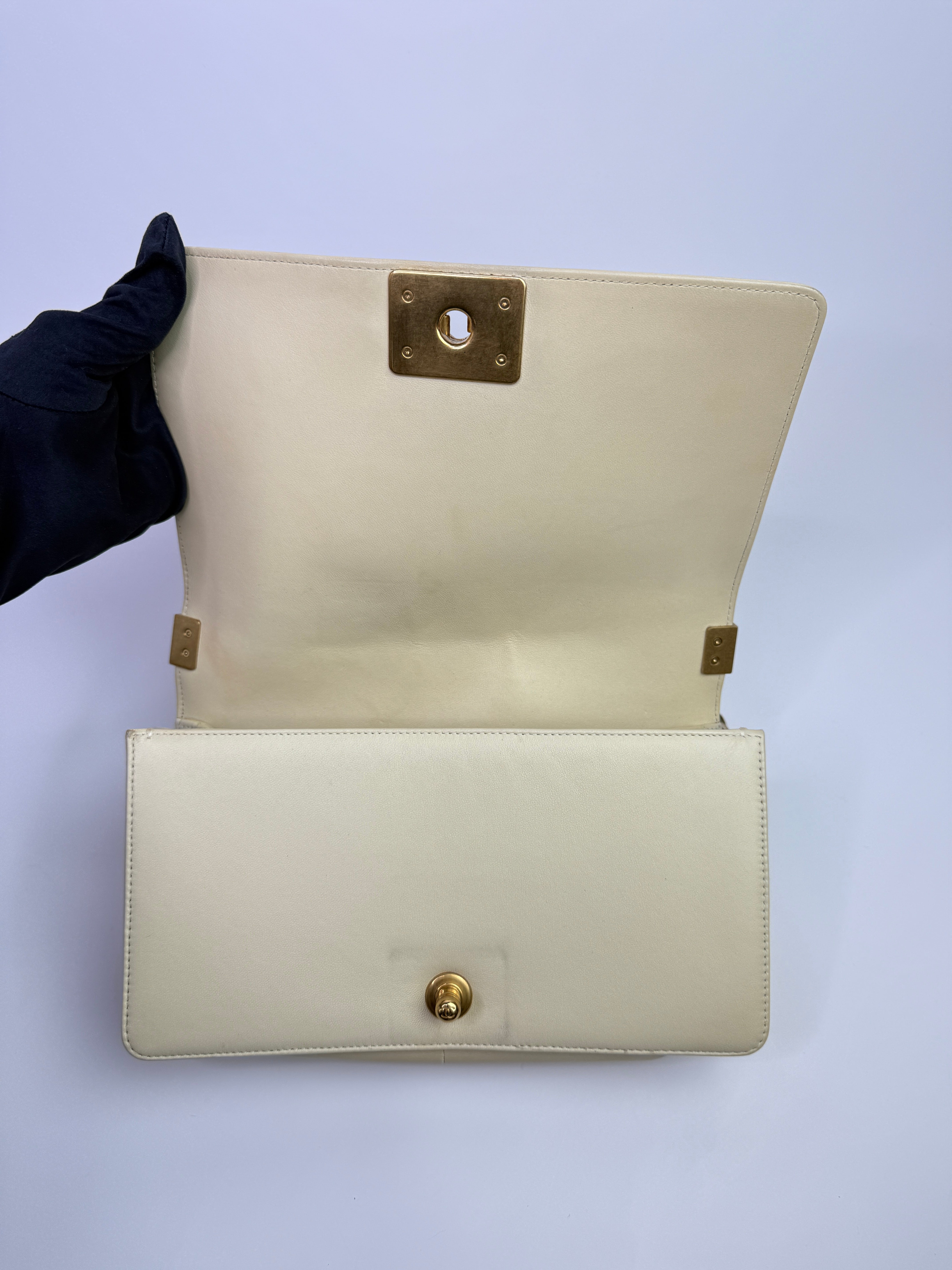 Authentic pre-loved Chanel Boy Bag Medium In Cream Lambskin With Gold Hardware. 