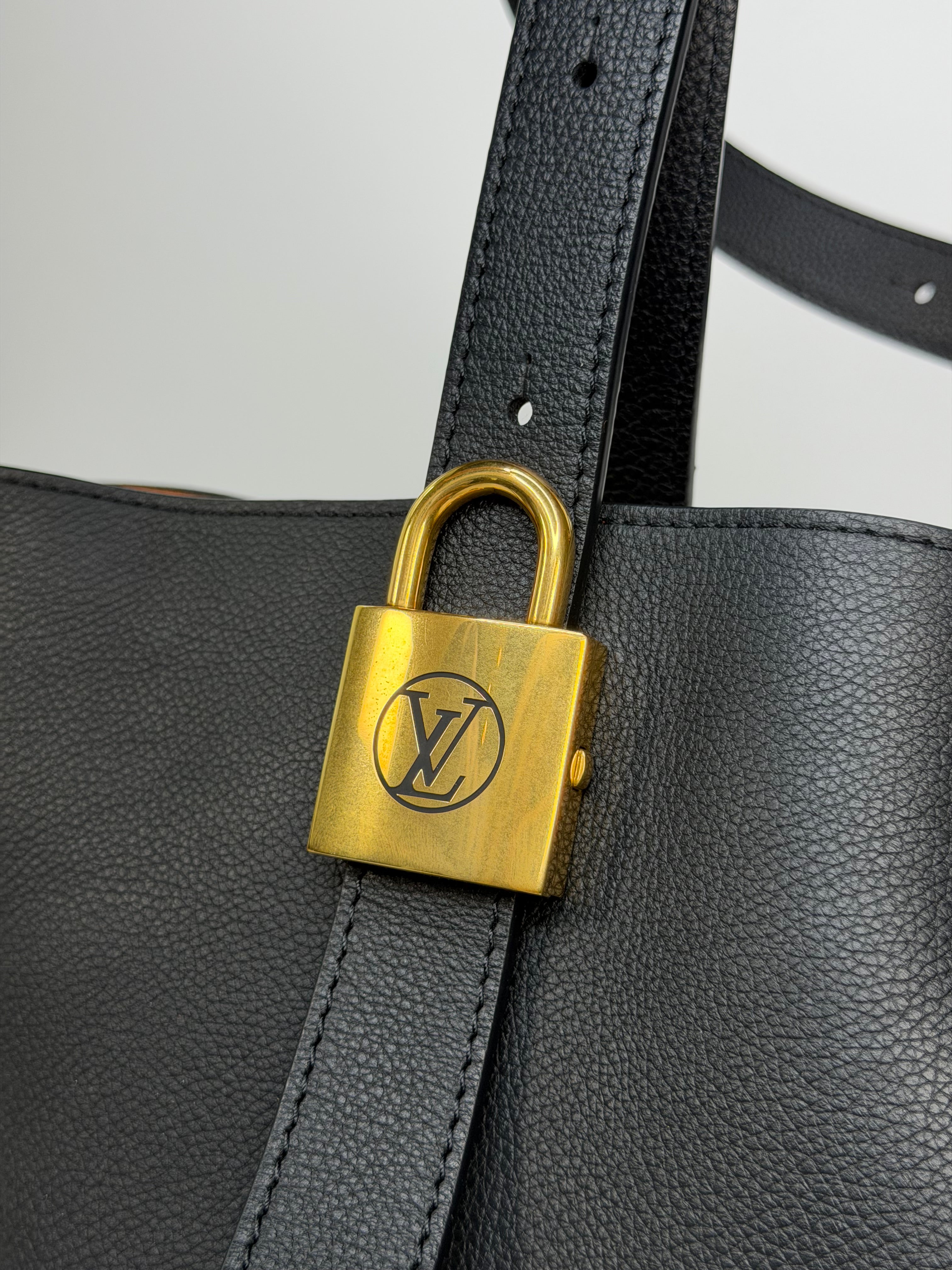 Louis Vuitton Low Key Cabas MM In Black Calfskin With Gold Hardware. Authentic and preloved in excellent condition