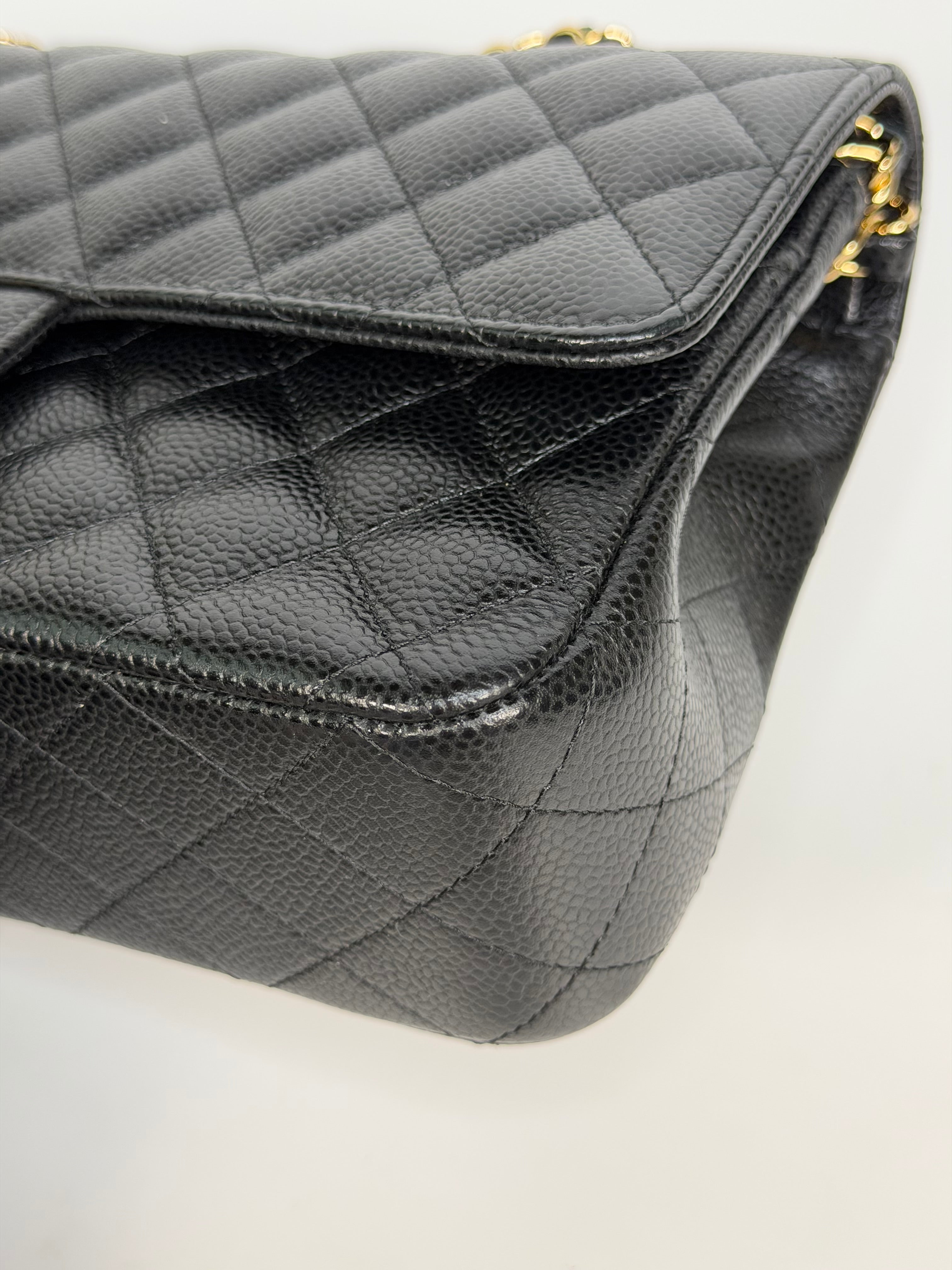 Chanel Medium Classic Double Flap In Black Caviar With Gold Hardware. Authentic and preloved in new and unused condition. 