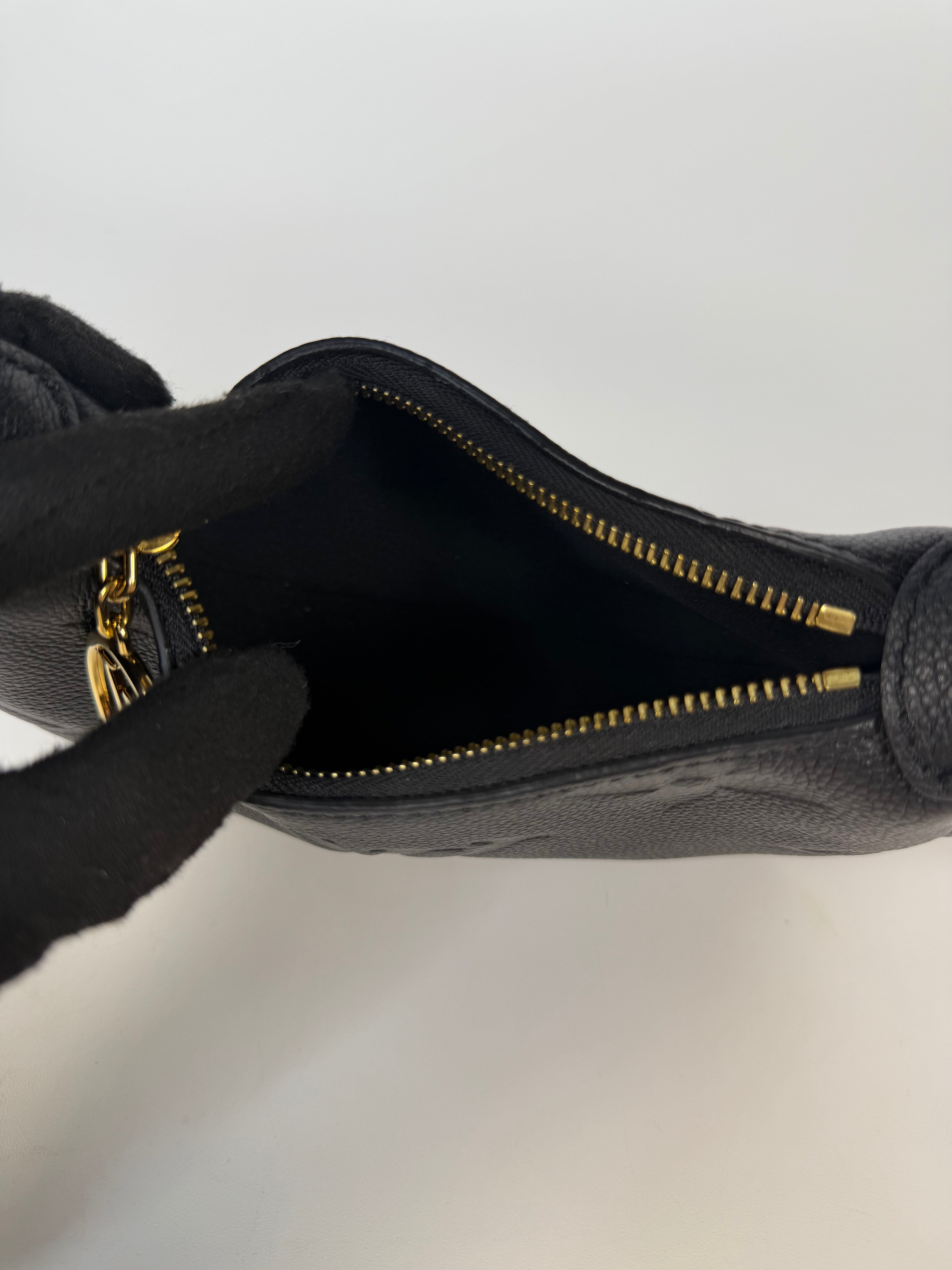 Louis Vuitton Mini Moon Bag In Black Leather With Gold Hardware in excellent condition 100% authentic and preloved