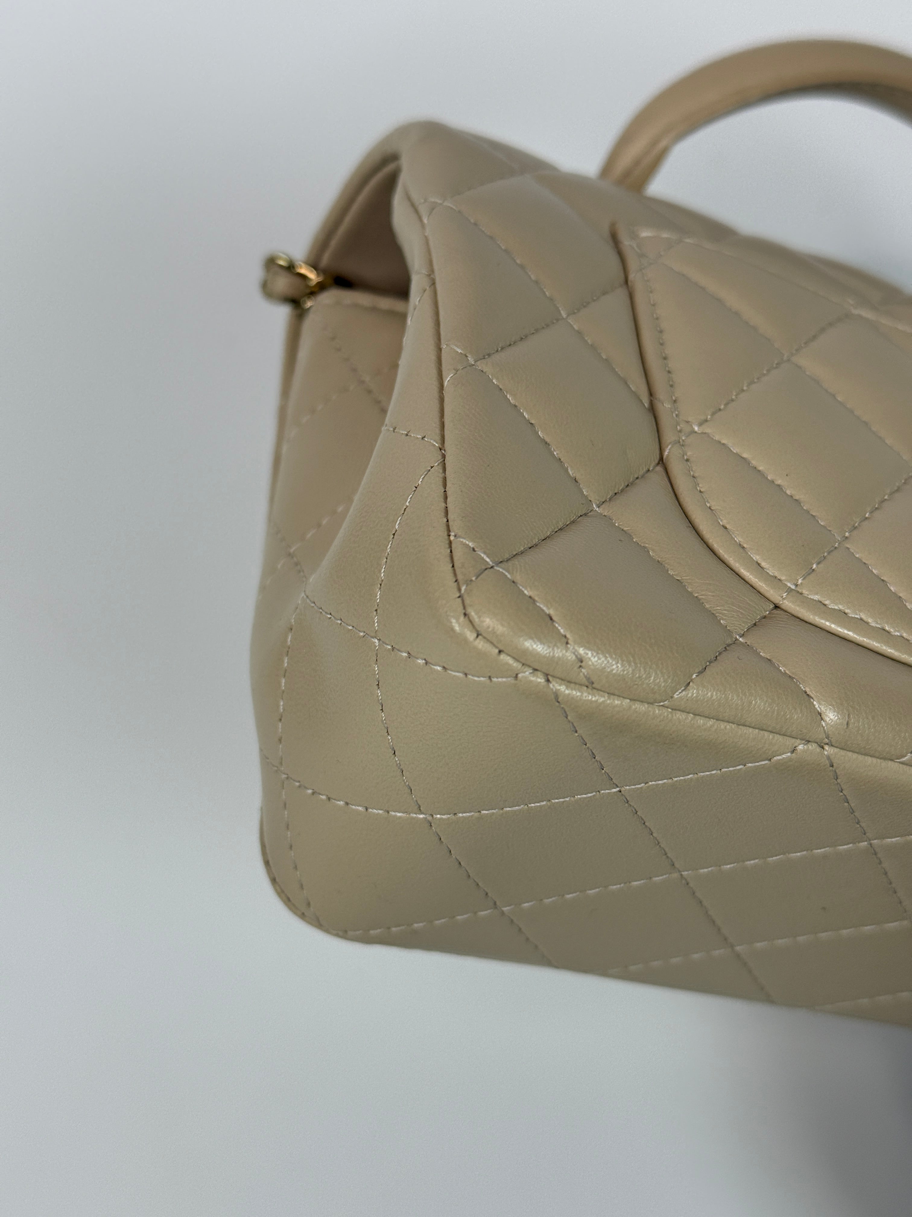 Authentic and preloved Chanel Mini Rectangle Top Handle In Ecru Lambskin With Gold Hardware in excellent condition, Fully insured next day delivery. Verified by Luxe Cheshire. 100% Authenticity guarantee,