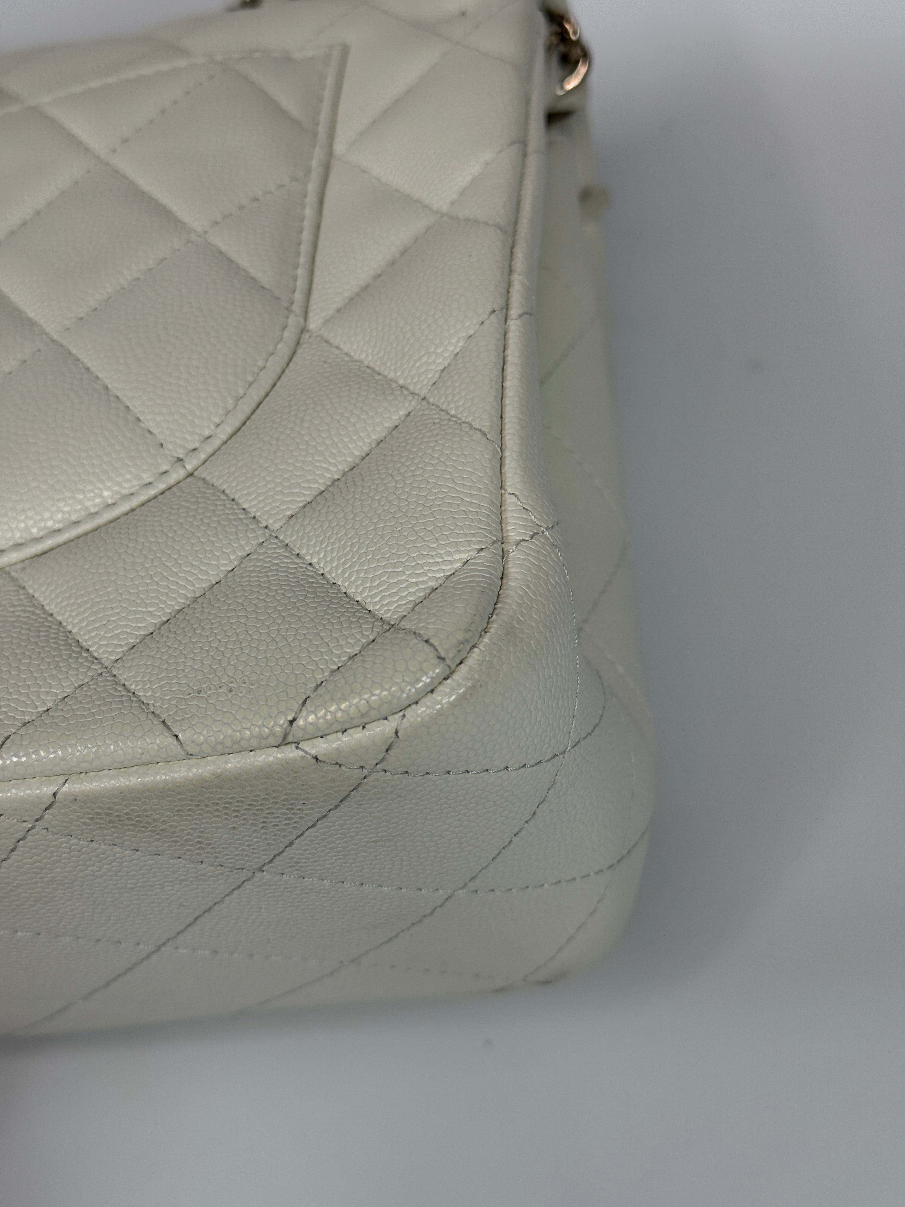 Authentic pre-loved Chanel Classic Jumbo Flap Bag In White Caviar Leather With pale gold  hardware in very good condition. Verified by Luxe Cheshire. International, fast  and fully insured delivery. Trusted designer resale.