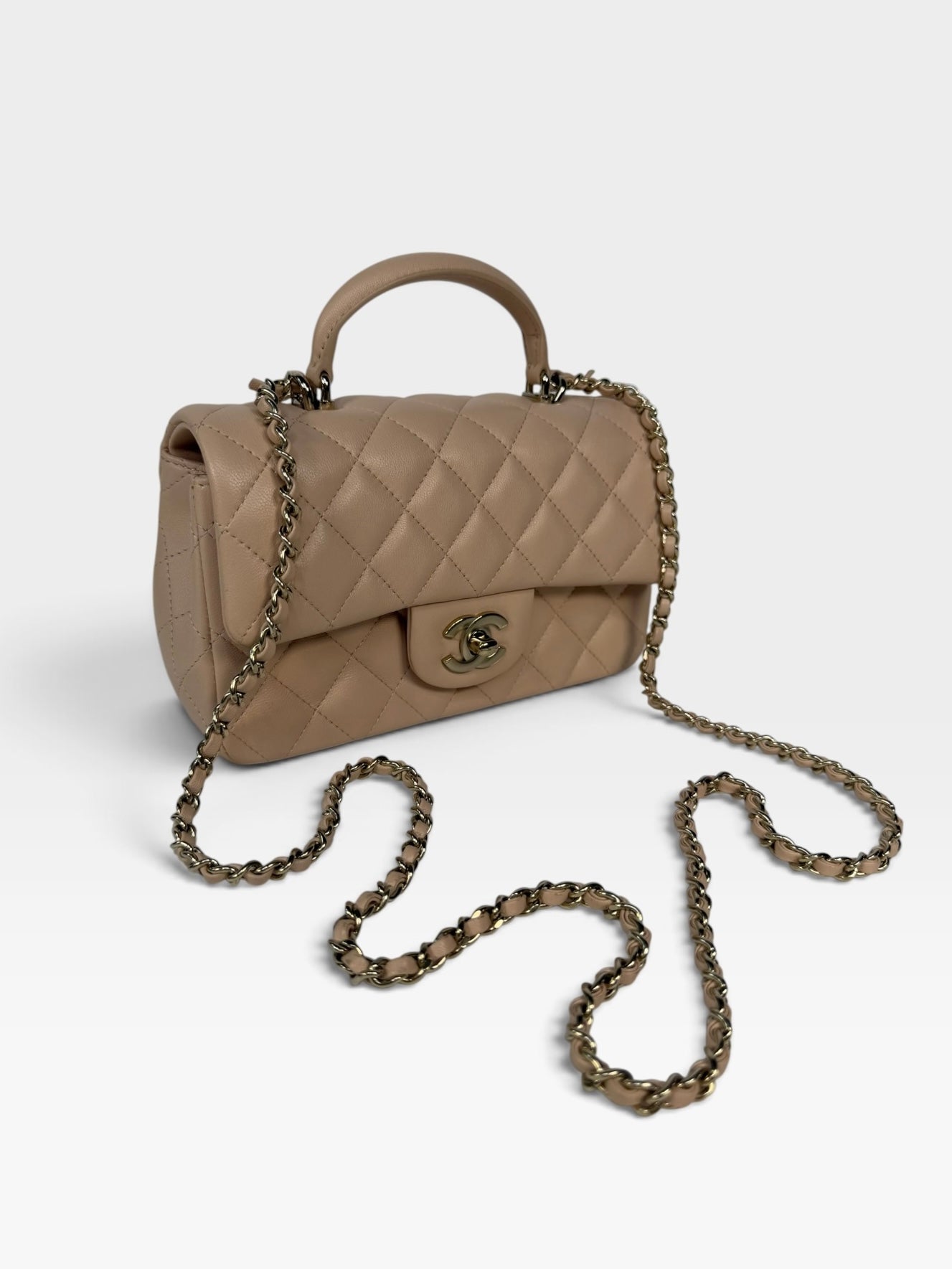 Chanel Mini Rectangle Top Handle Beige Lambskin Pale Gold Hardware. 100% authentic and preloved in excellent condition.