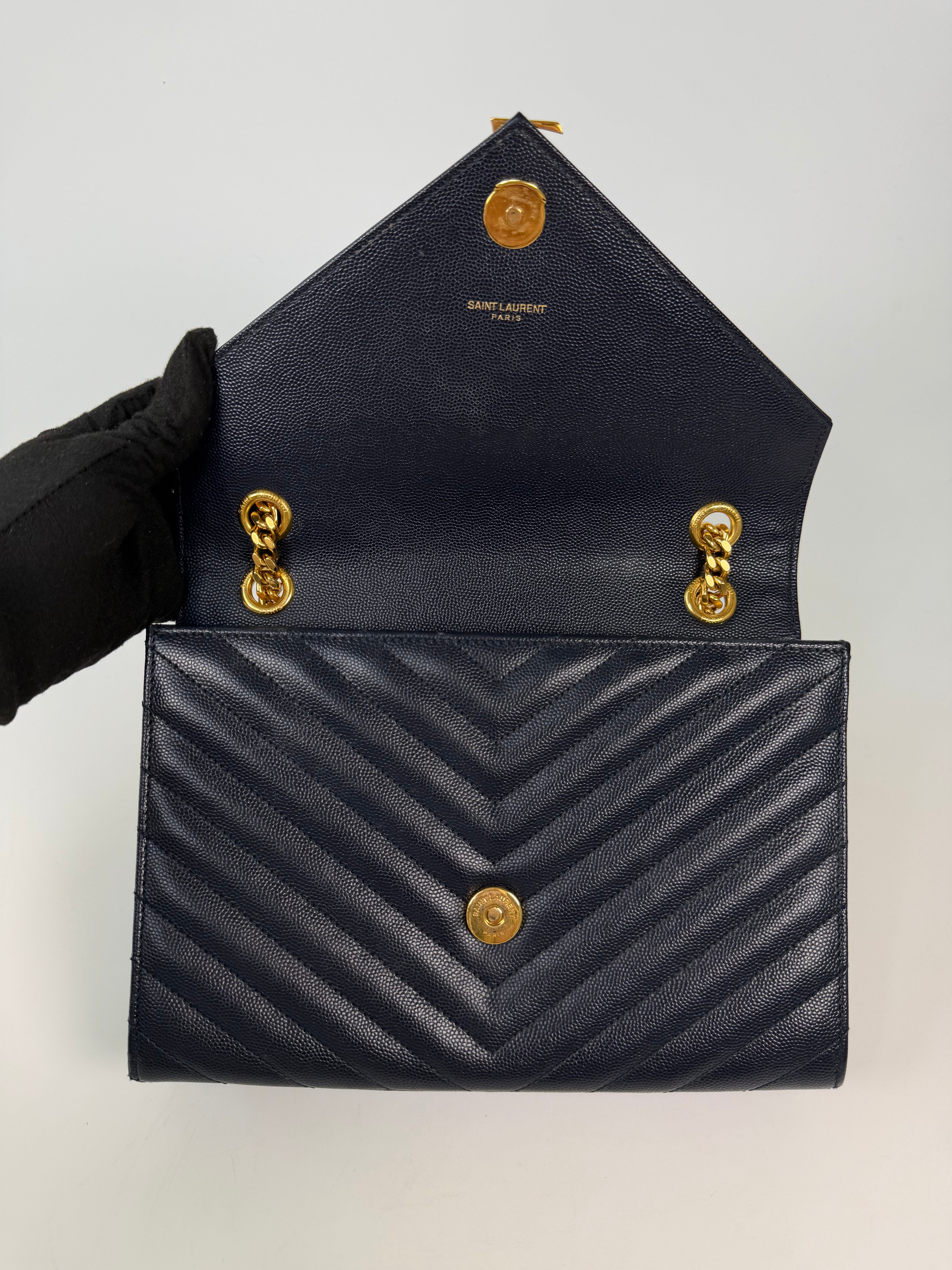 Authentic and pre loved Saint Laurent Medium Envelope Bag In Blue Grained Leather With Gold Hardware. Excellent Condition. Verified by Luxe Cheshire 