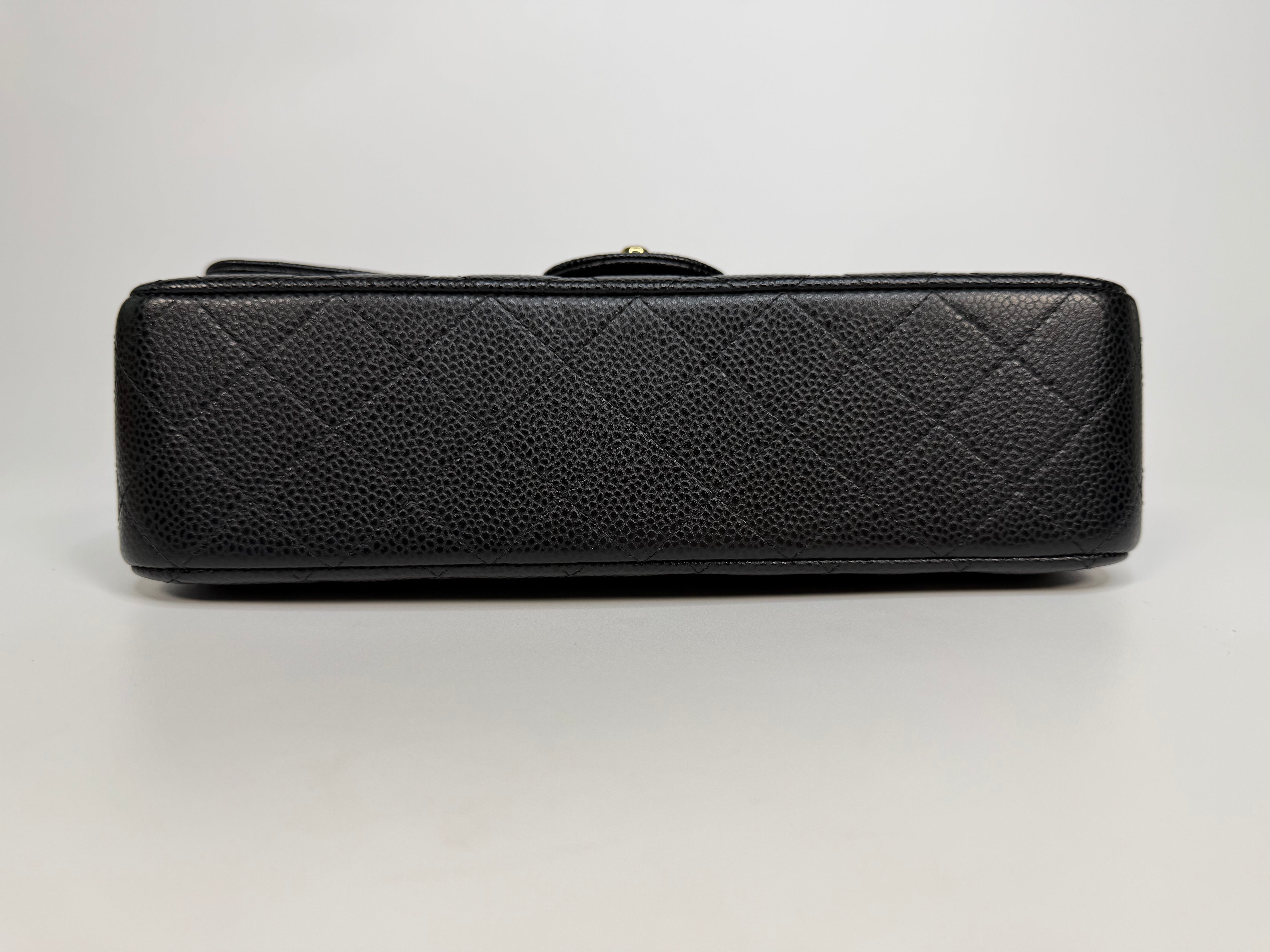 Chanel Medium Classic Double Flap In Black Caviar With Gold Hardware. Authentic and preloved in new and unused condition. 
