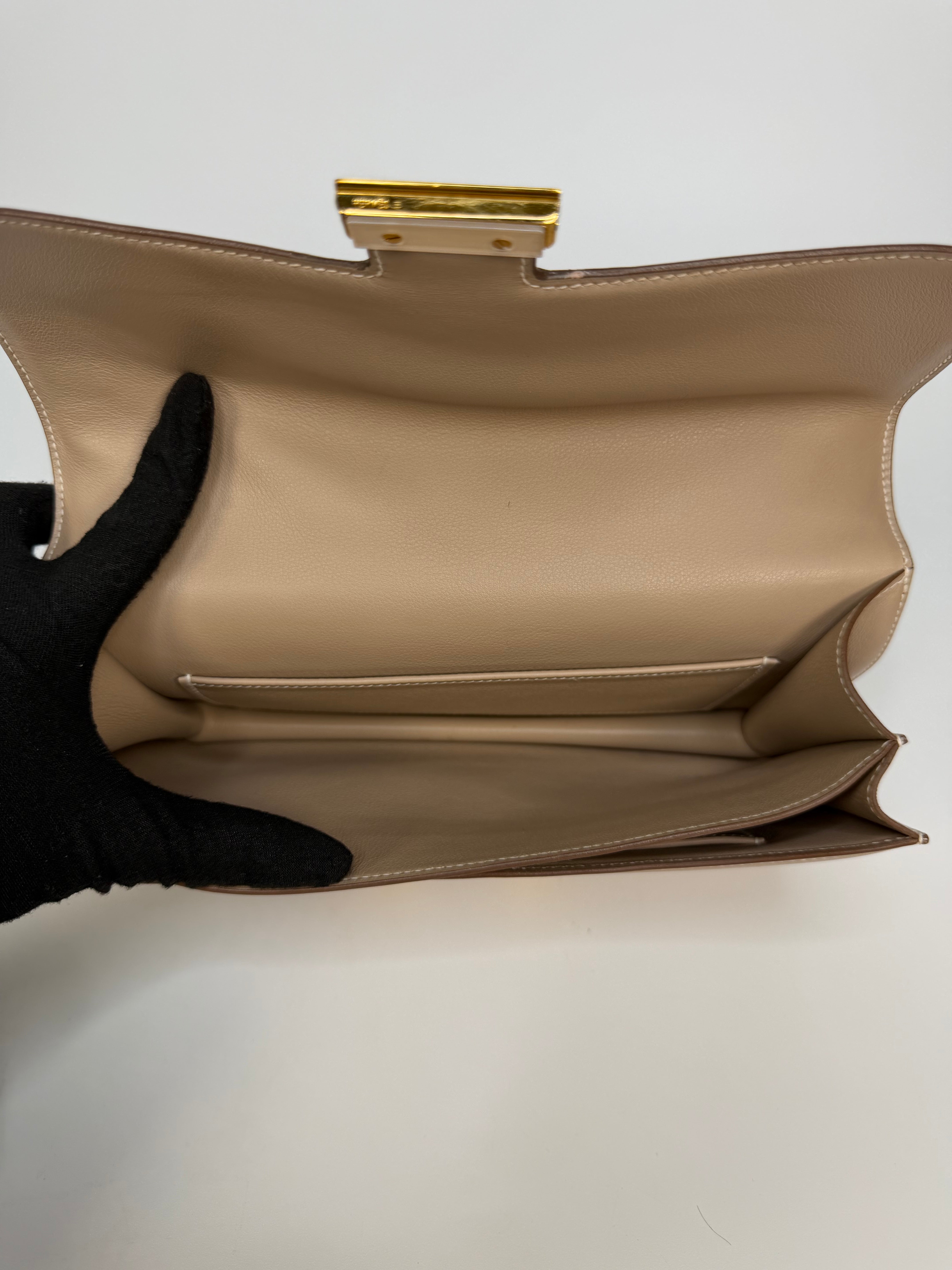 Hermès Constance Elan In Trench Swift Leather With Gold Hardware. Authentic and preloved in very good condition