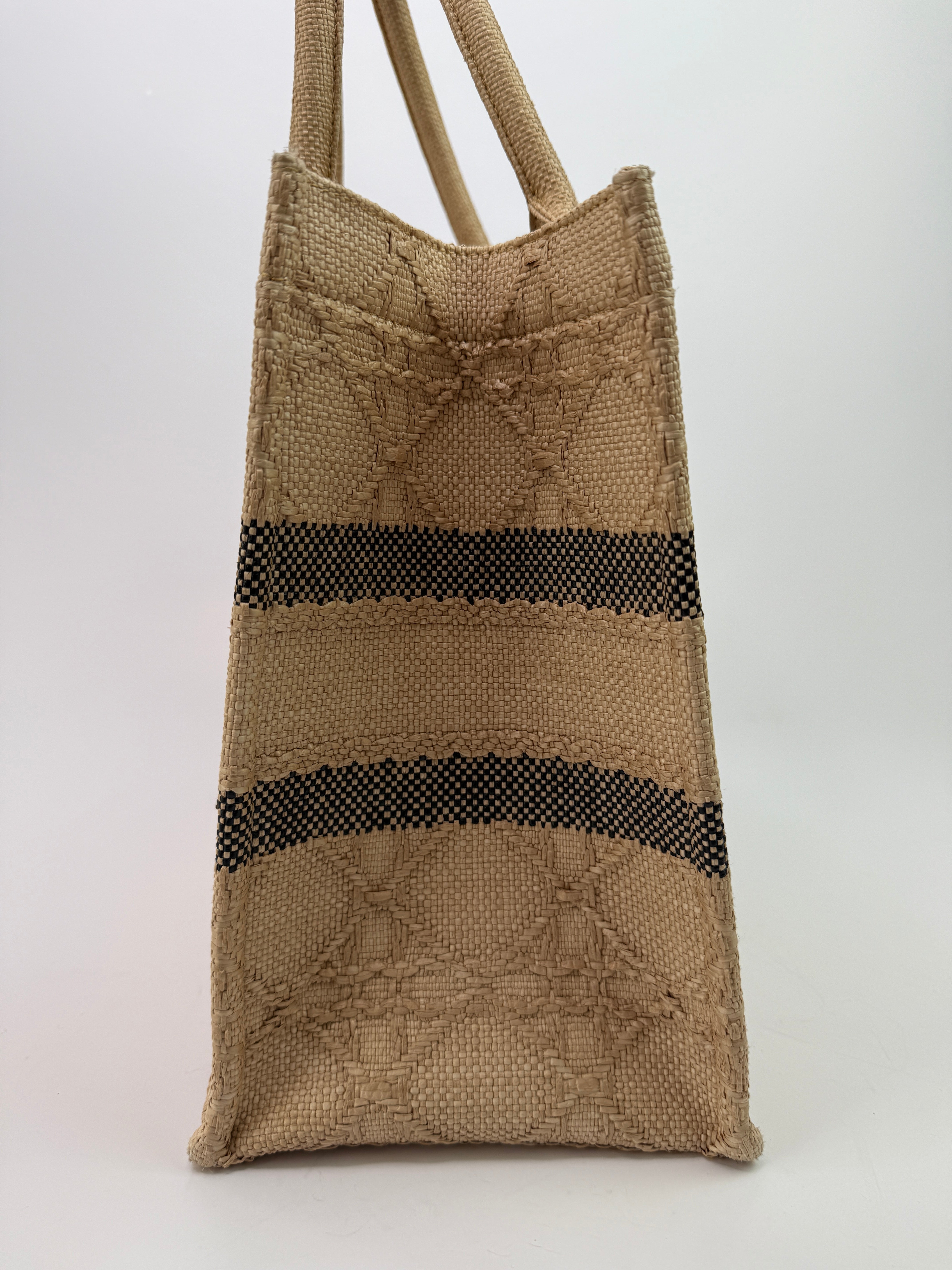 Authentic pre-loved Christian Dior Medium Raffia Cannage Book Tote. 