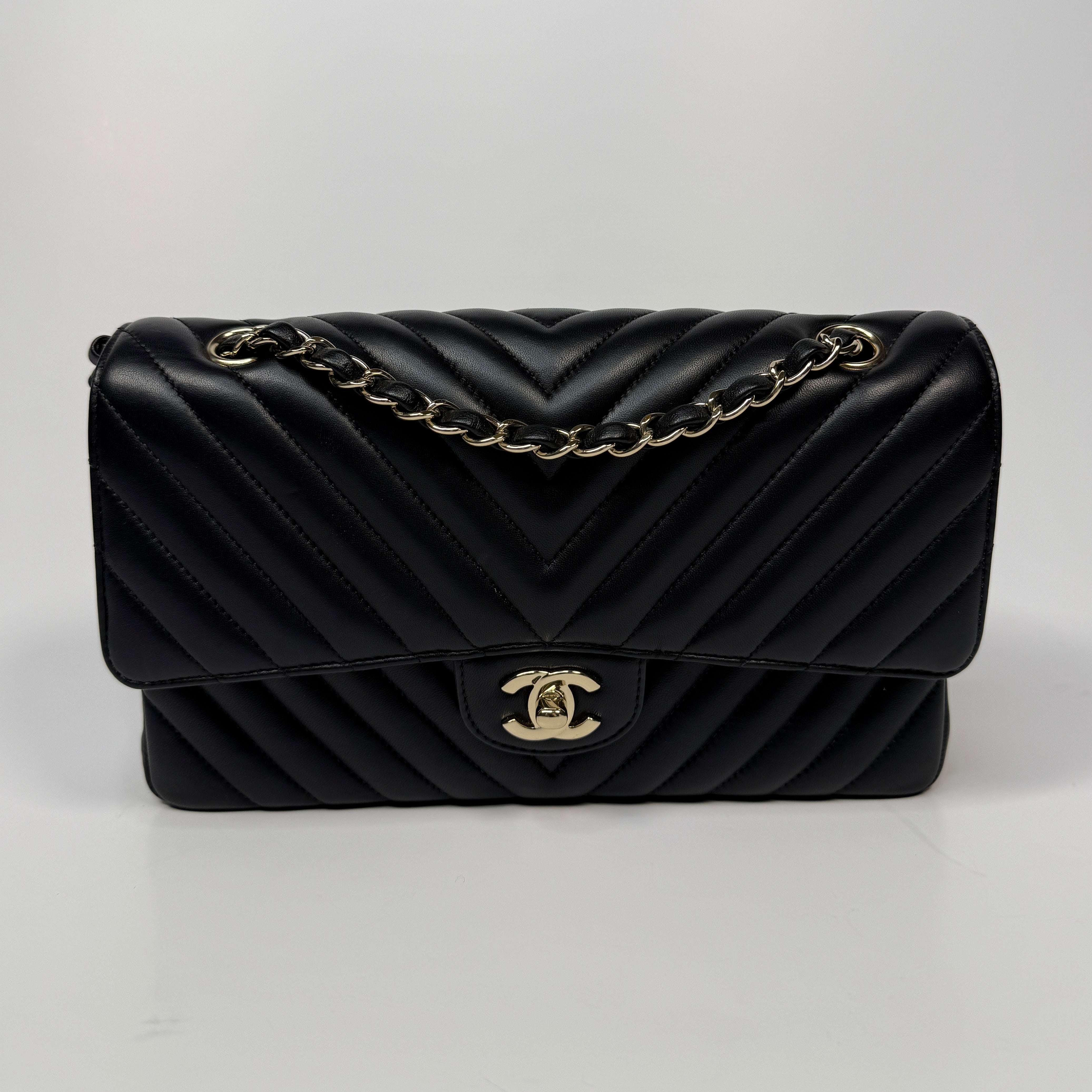 Chanel Medium Classic Double Flap Chevron Black Lambskin With Pale Gold Hardware. Excellent condition. Authentic and preloved. 100% Authenticity guarantee 