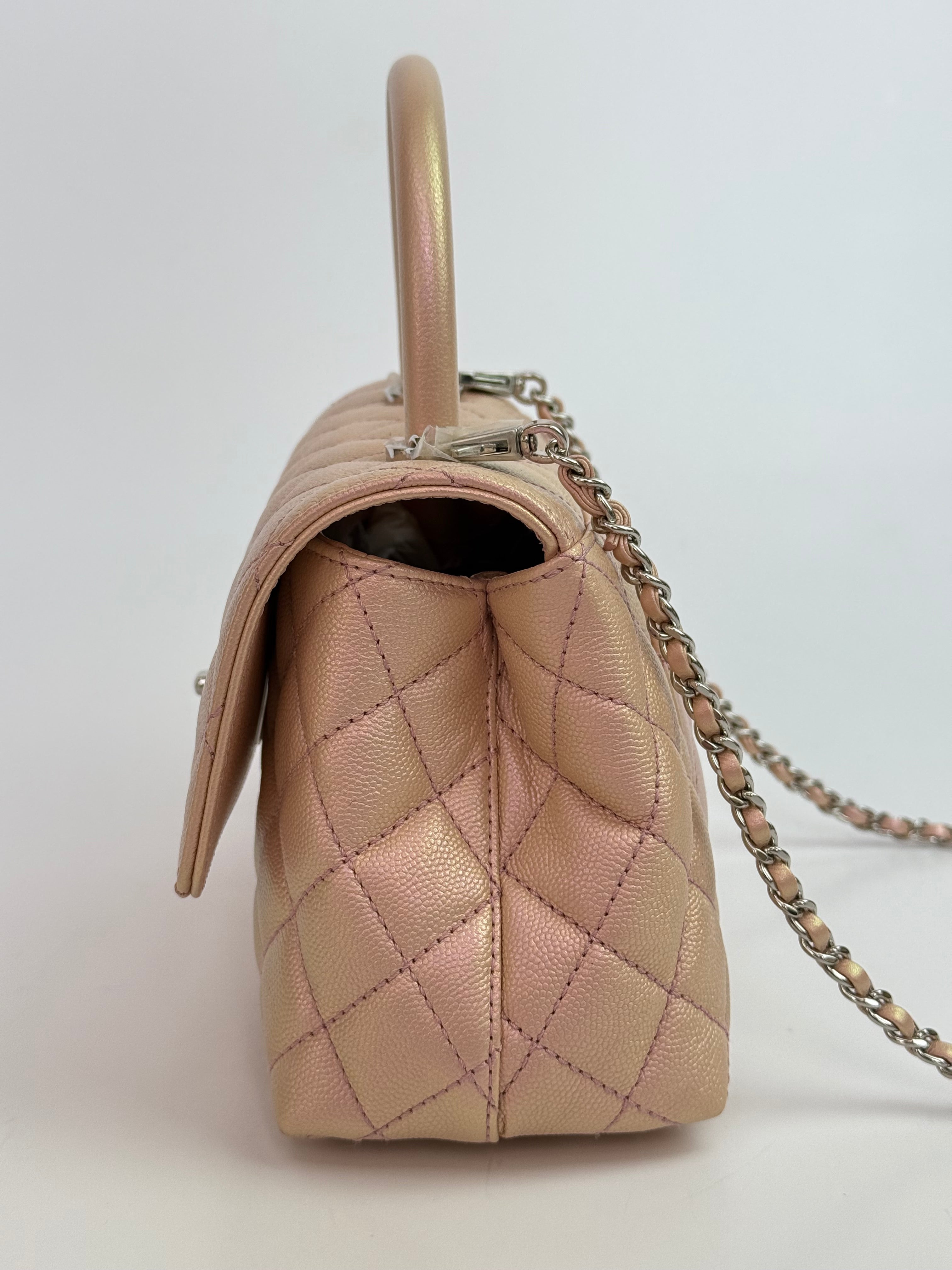 Authentic pre-loved Chanel Small Coco In Iridescent Pink Caviar With Rainbow Hardware. 