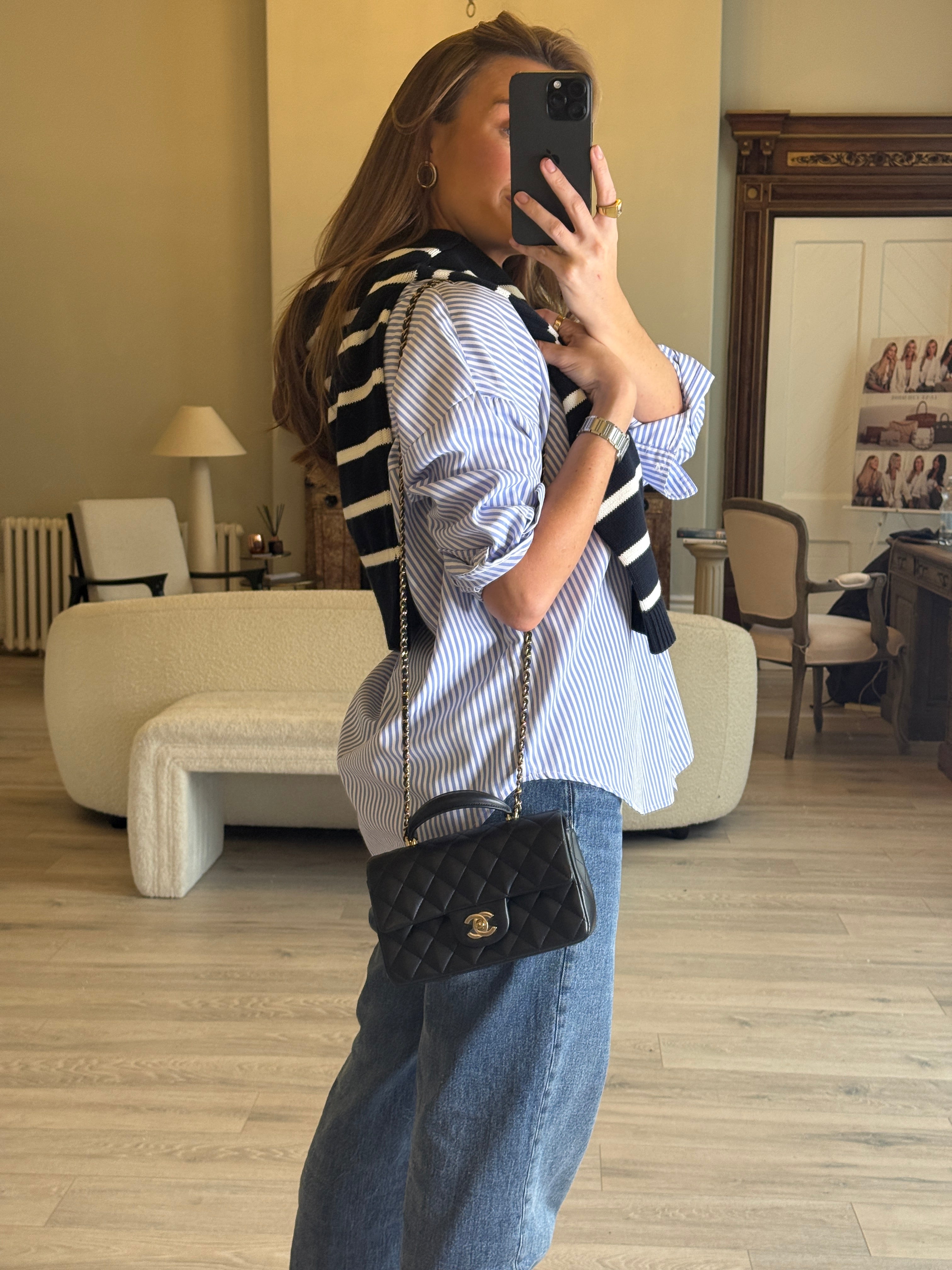 Authentic and preloved Chanel Mini Rectangle Top Handle Flap Bag In Black Lambskin With Gold hardware. Excellent Condition. 100% Authenticity guarantee 