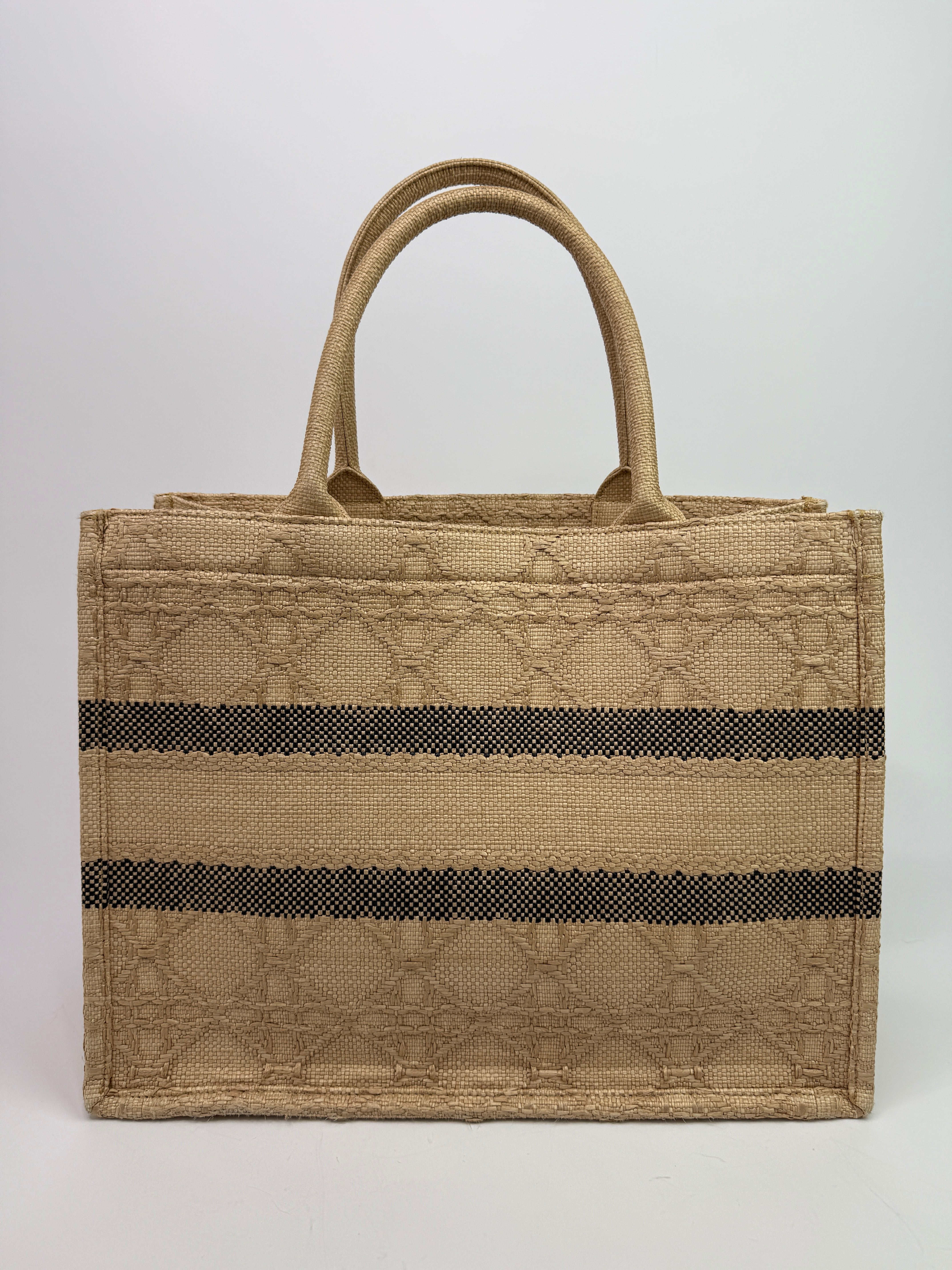 Authentic pre-loved Christian Dior Medium Raffia Cannage Book Tote. 