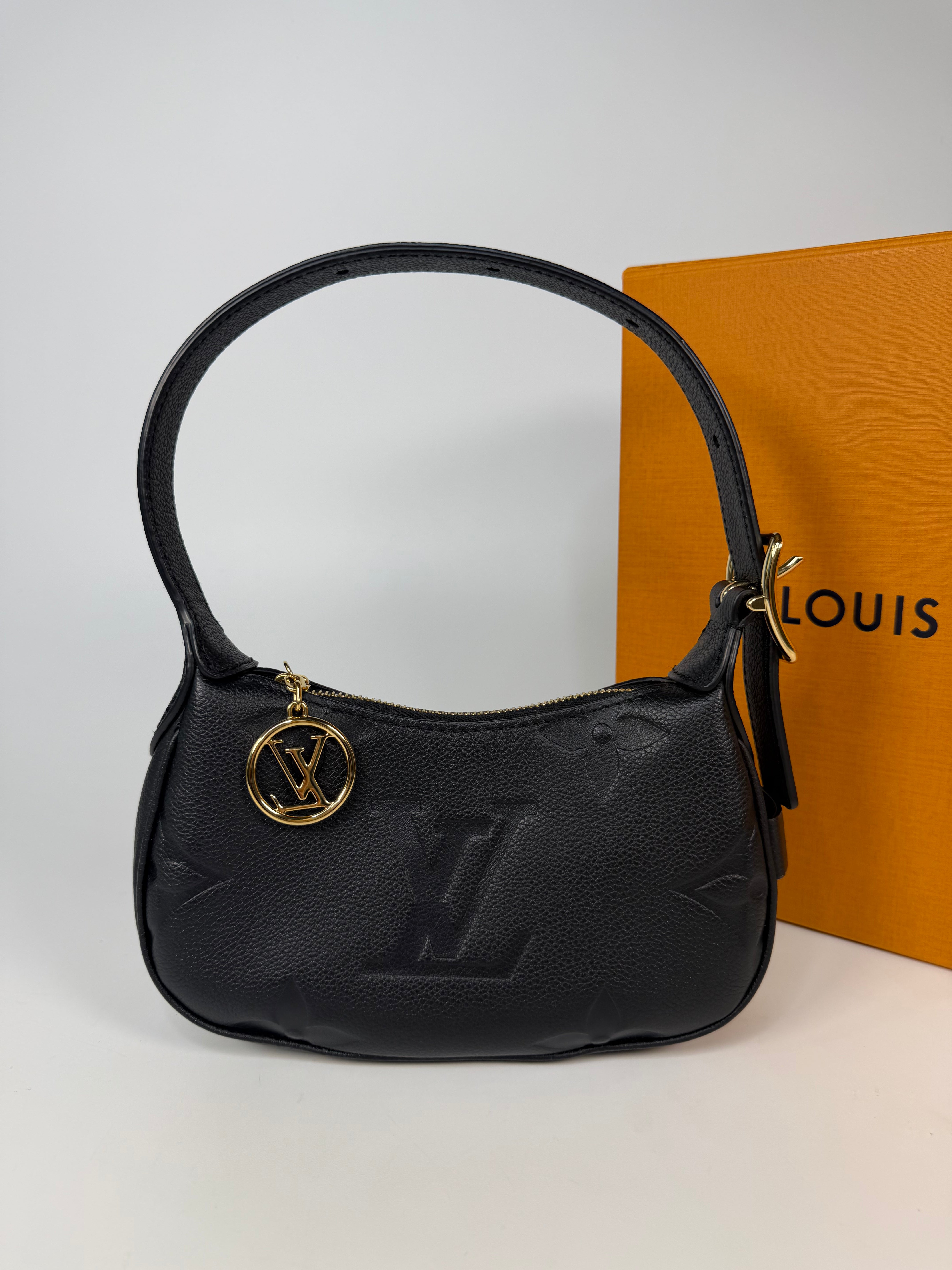 Louis Vuitton Mini Moon Bag In Black Leather With Gold Hardware in excellent condition 100% authentic and preloved