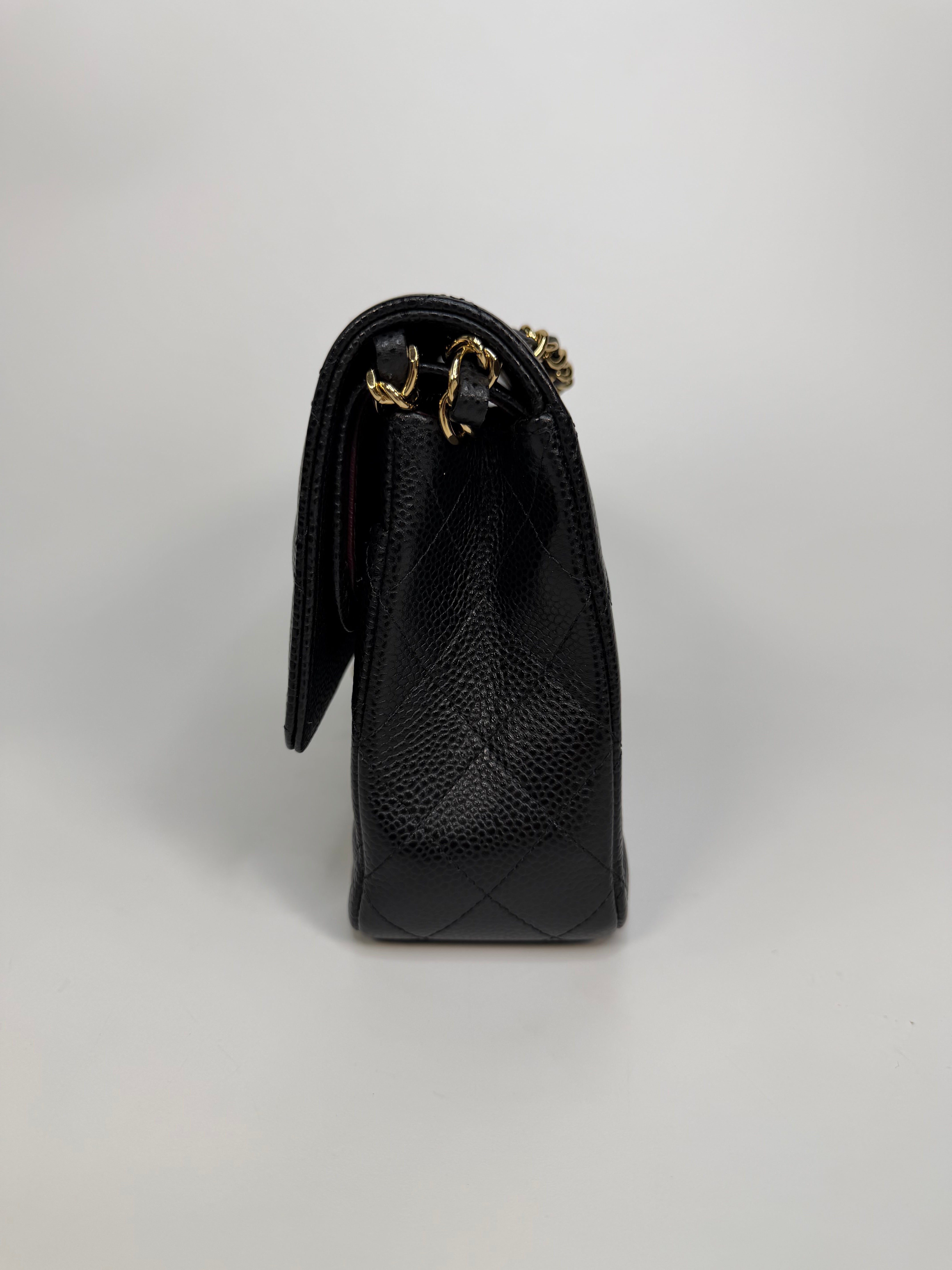 Chanel Medium Classic Double Flap In Black Caviar With Gold Hardware. Authentic and preloved in new and unused condition. 