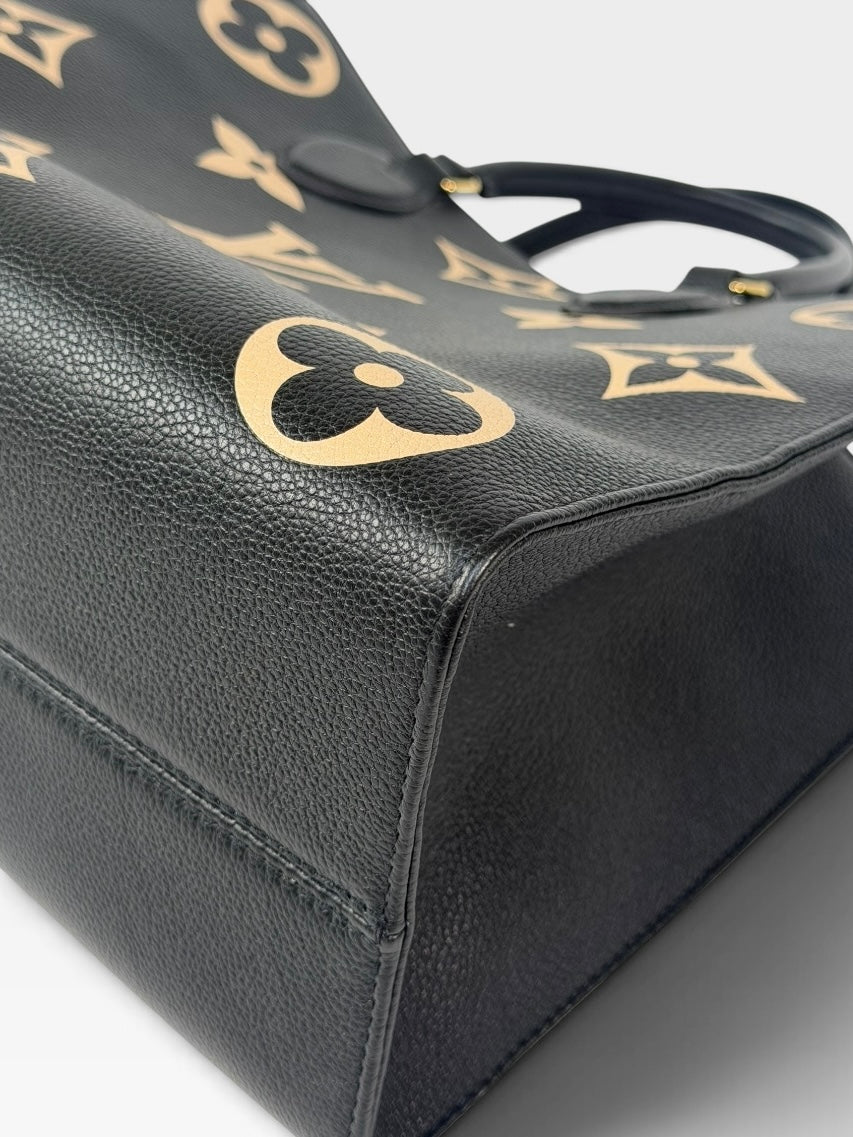Louis Vuitton On The Go MM Tote In Black & Beige Leather With Gold Hardware. 100% authentic and preloved in excellent condition
