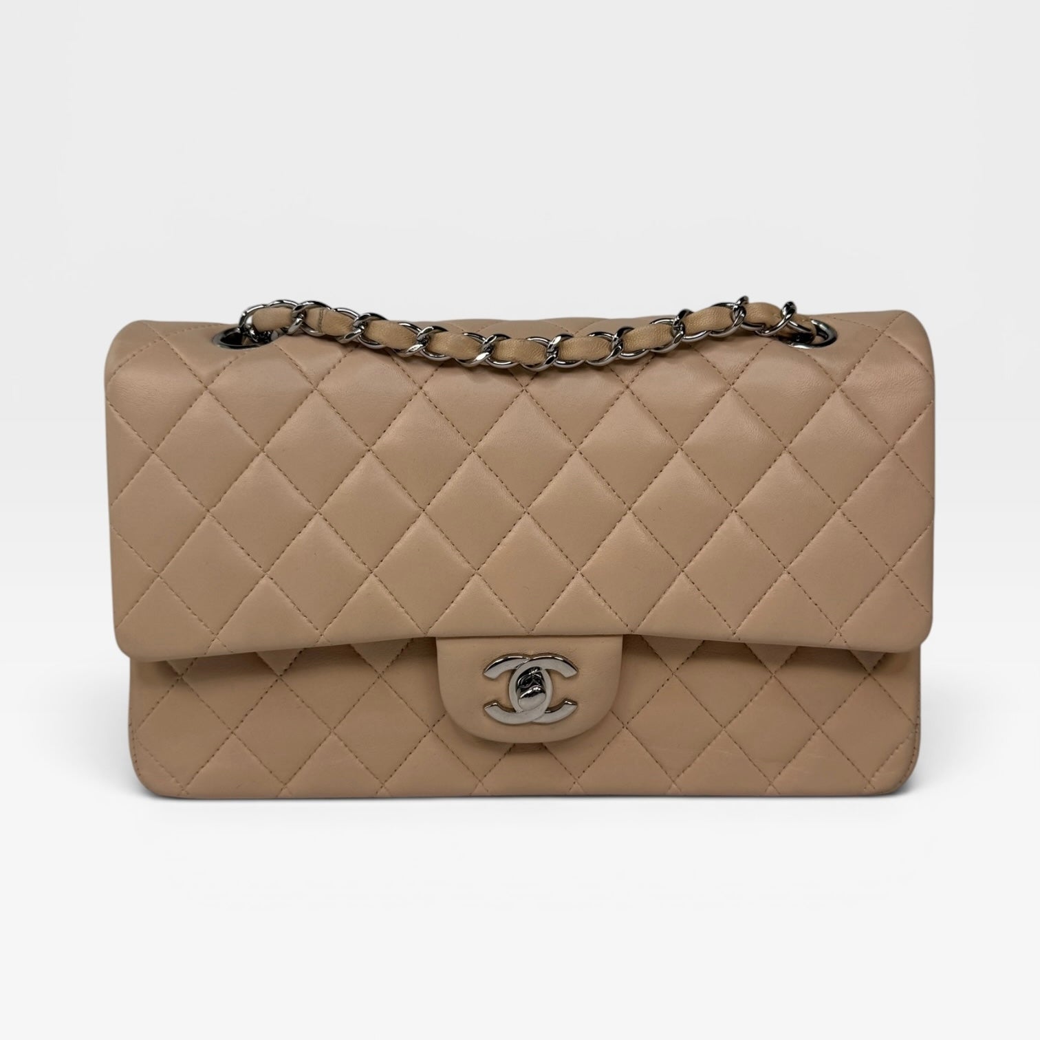 Authentic and preloved Chanel Medium Classic Double Flap Light Beige Lambskin Leather With Silver Hardware