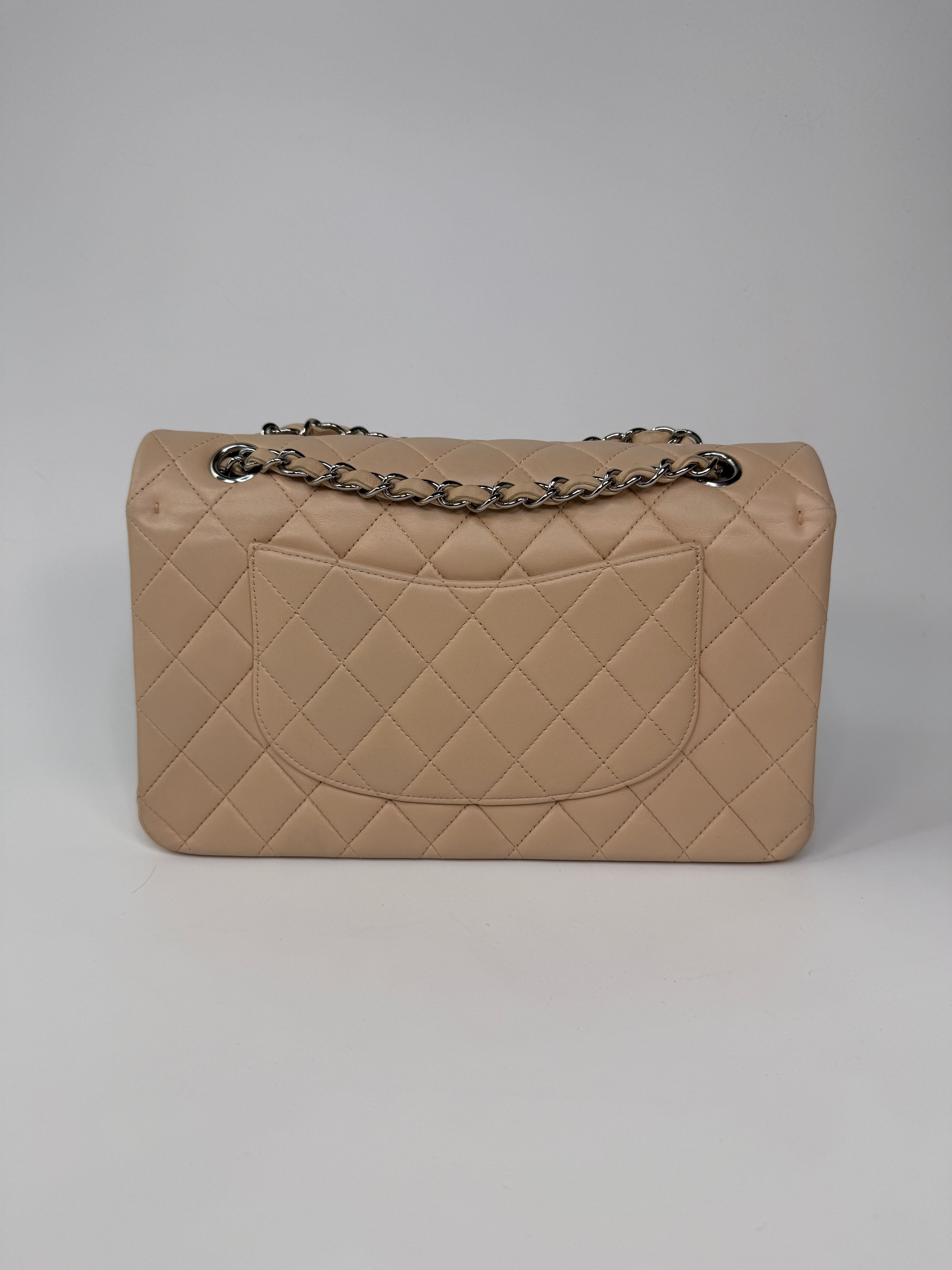 Authentic and preloved Chanel Medium Classic Double Flap Light Beige Lambskin Leather With Silver Hardware