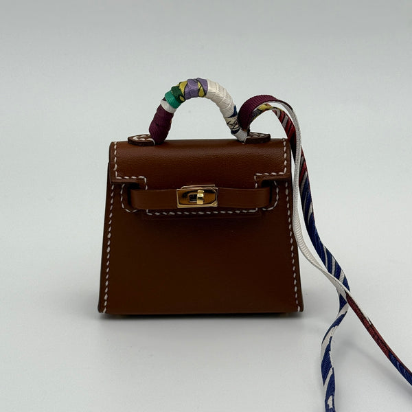 Hermès Kelly Twilly Charm In Gold Tadelakt Leather With GHW