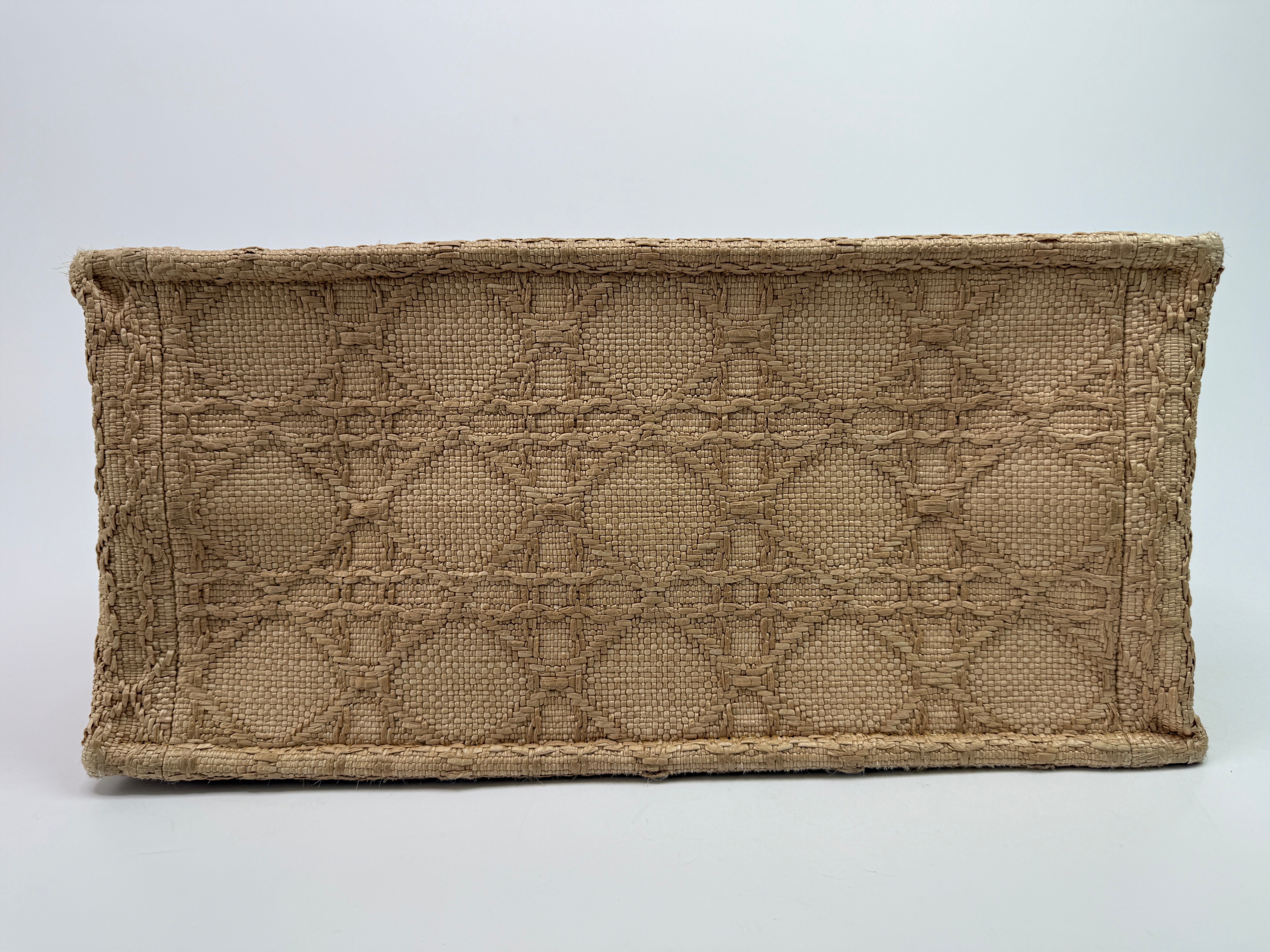 Authentic pre-loved Christian Dior Medium Raffia Cannage Book Tote. 