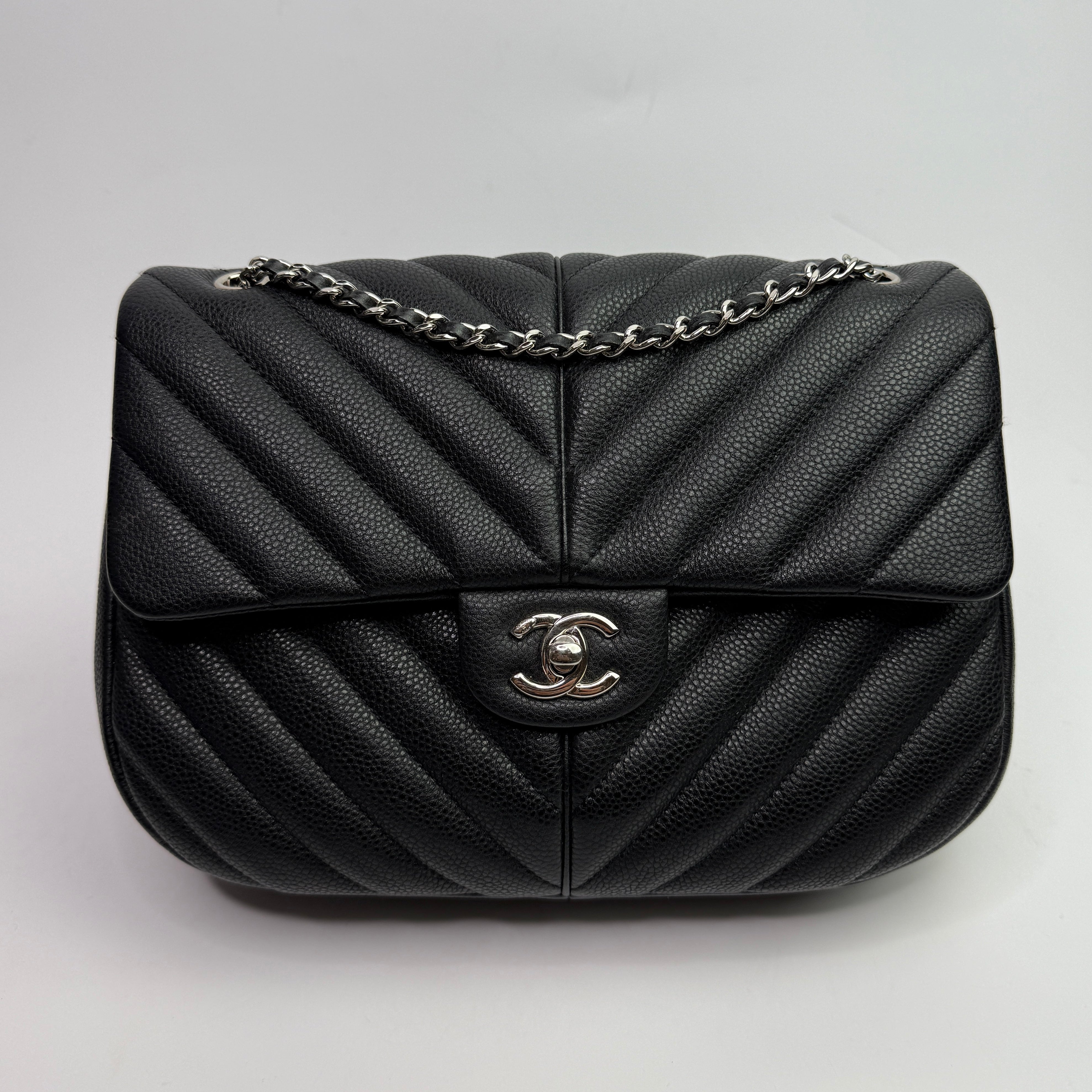 Chanel Seasonal Flap Bag In Black Chevron Caviar Leather With SHW