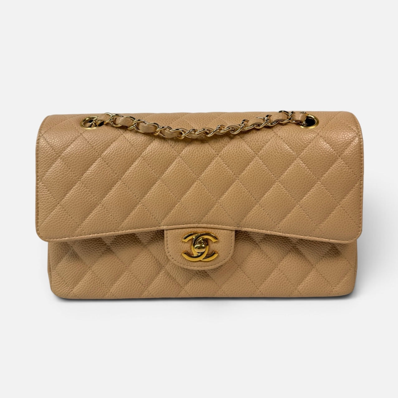 Chanel Medium Classic Flap In Beige Caviar Leather With Gold Hardware. 100% authentic and preloved in excellent condition