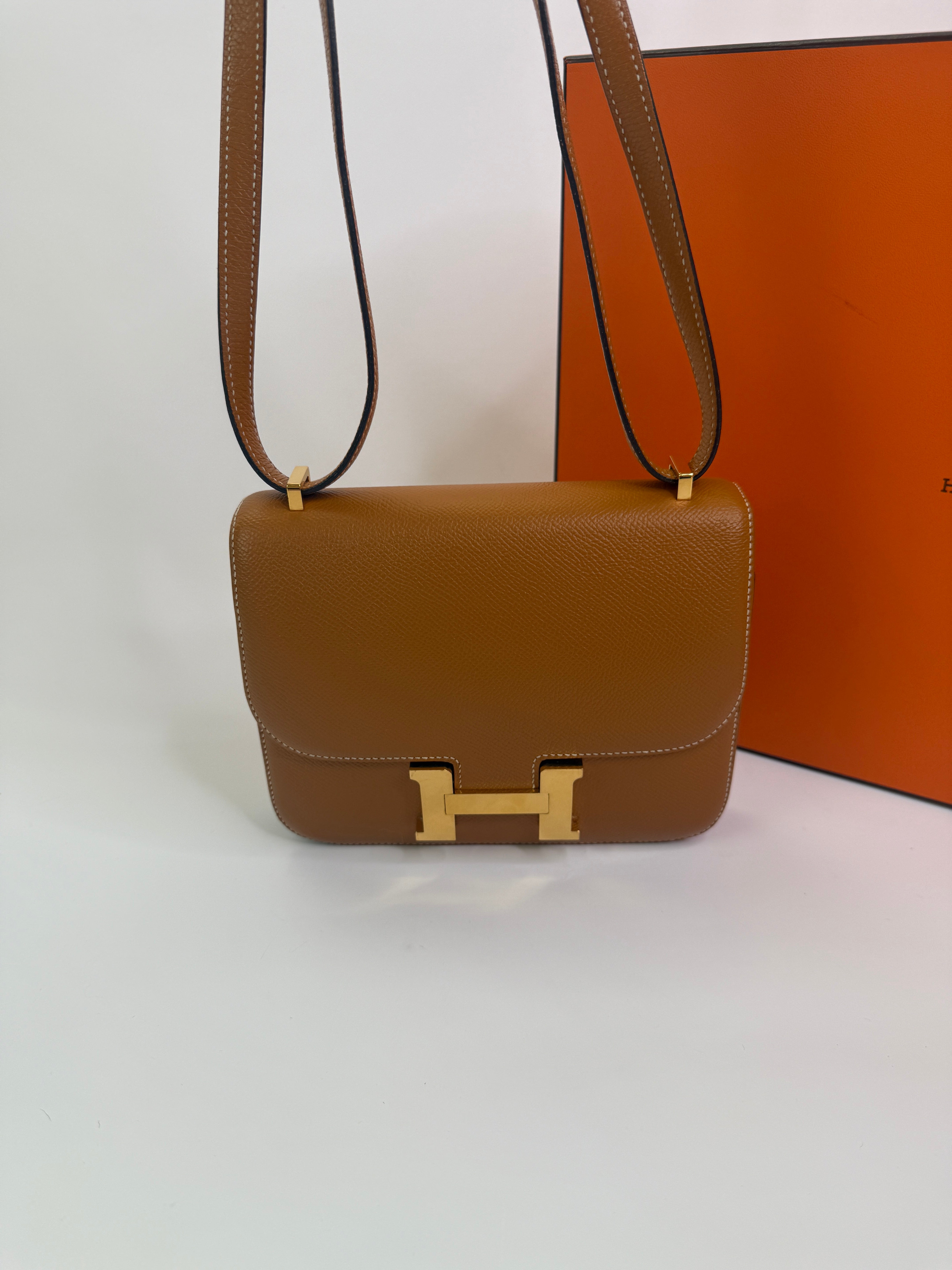 Authentic pre-lovedHermès Constance 18 In Toffee Epsom Leather With Gold Hardware. 