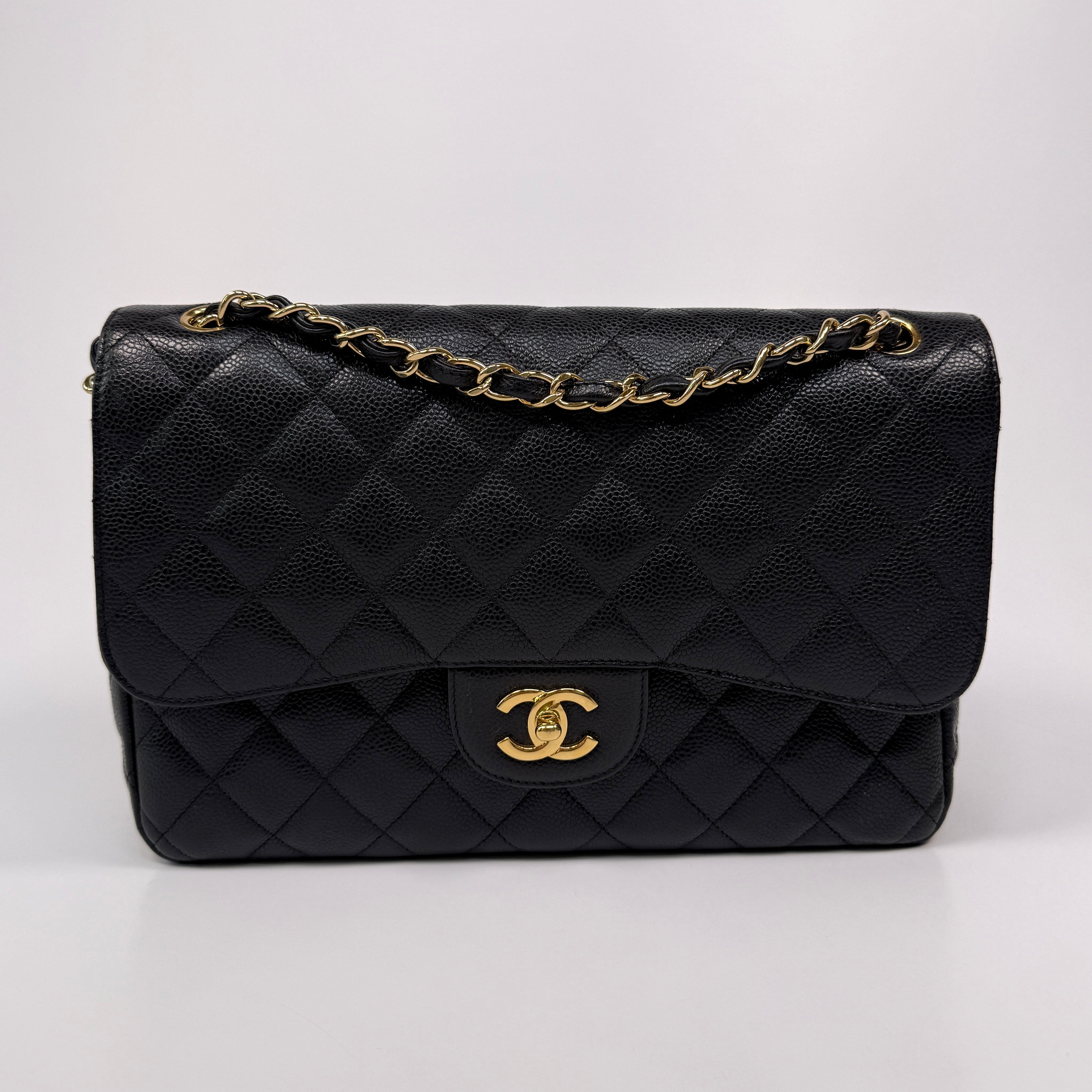 Chanel Classic Jumbo Flap Bag In Black Caviar LeatherWith Gold Hardware
Pre Loved & Authentic 