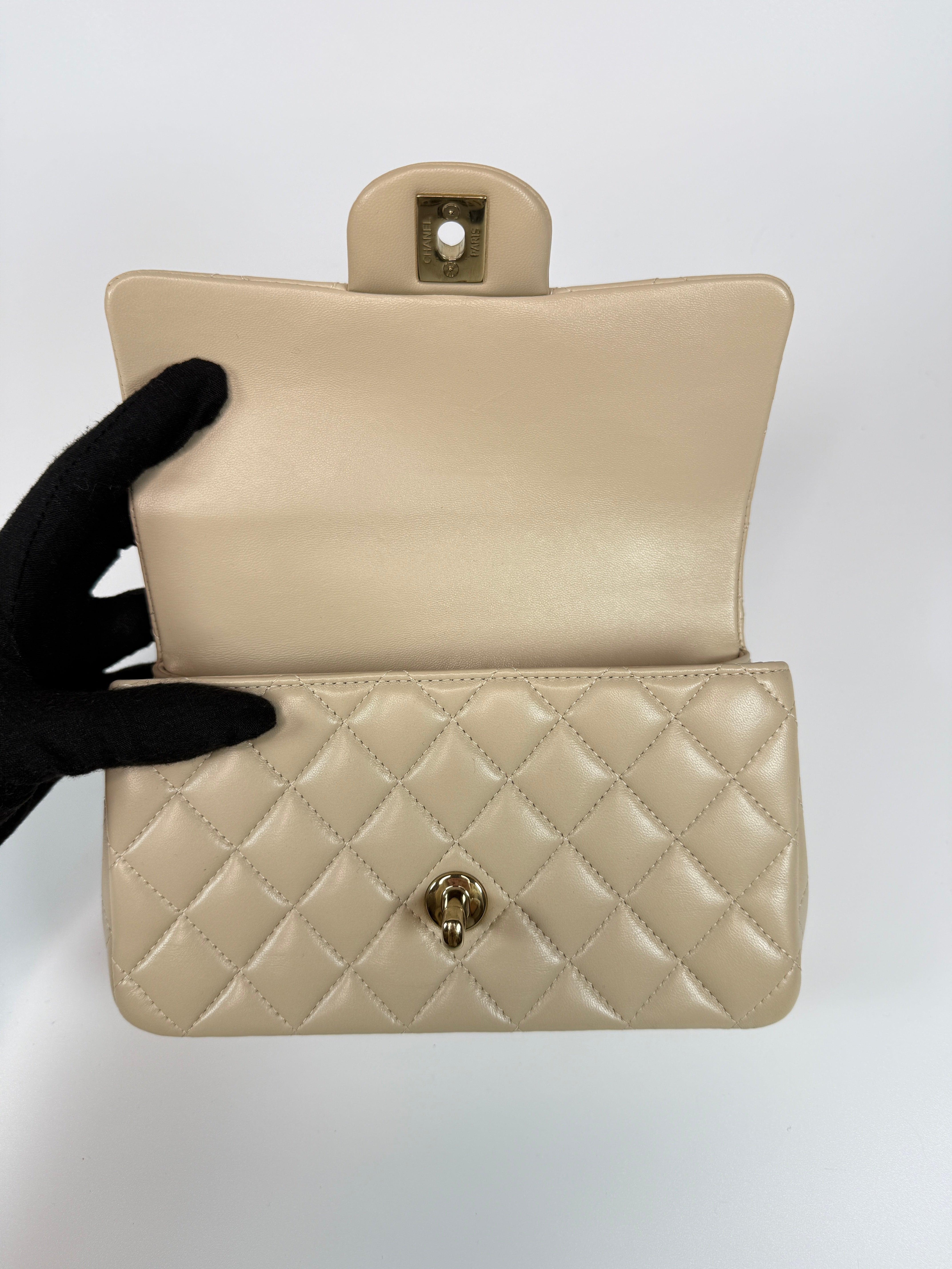 Authentic and preloved Chanel Mini Rectangle Top Handle In Ecru Lambskin With Gold Hardware in excellent condition, Fully insured next day delivery. Verified by Luxe Cheshire. 100% Authenticity guarantee,