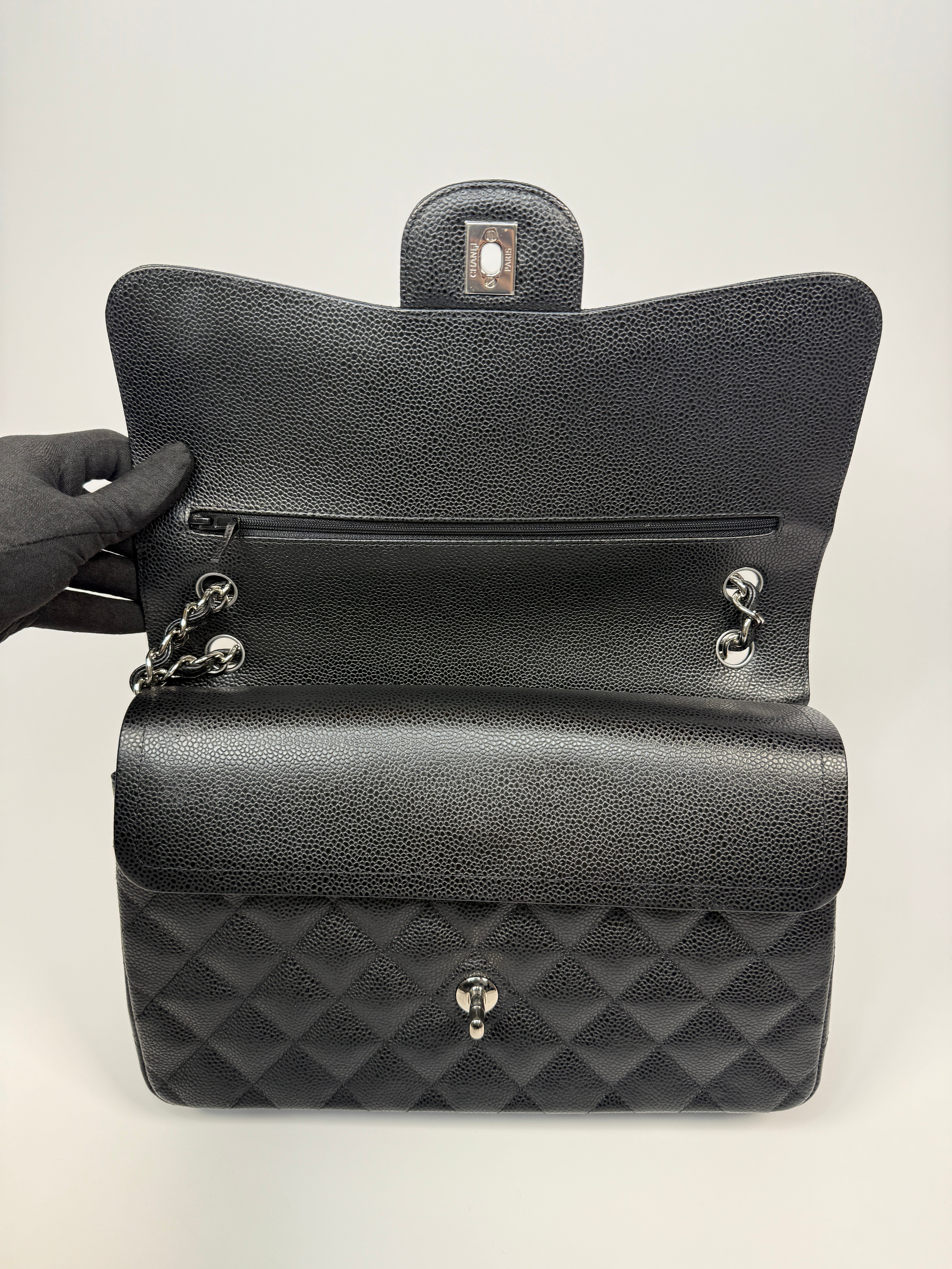 Chanel Classic Jumbo Flap Bag In Black Caviar Leather With Silver Hardware. Authentic and preloved. Excellent condition.