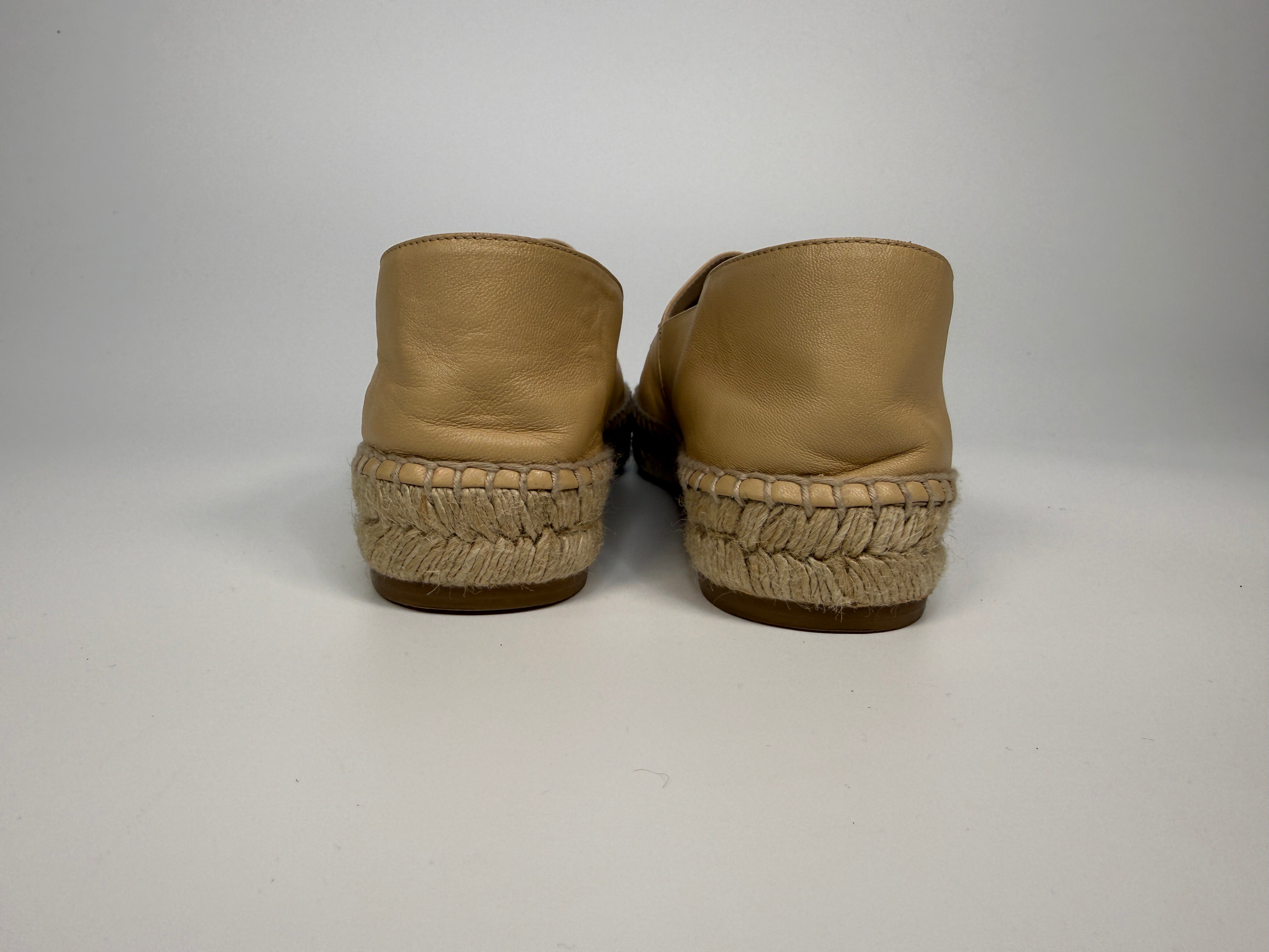 Authentic and preloved Chanel Espadrilles (Size 38/UK5) In Beige and Black Lambskin Leather. Excellent condition. 100% Authenticity guarantee