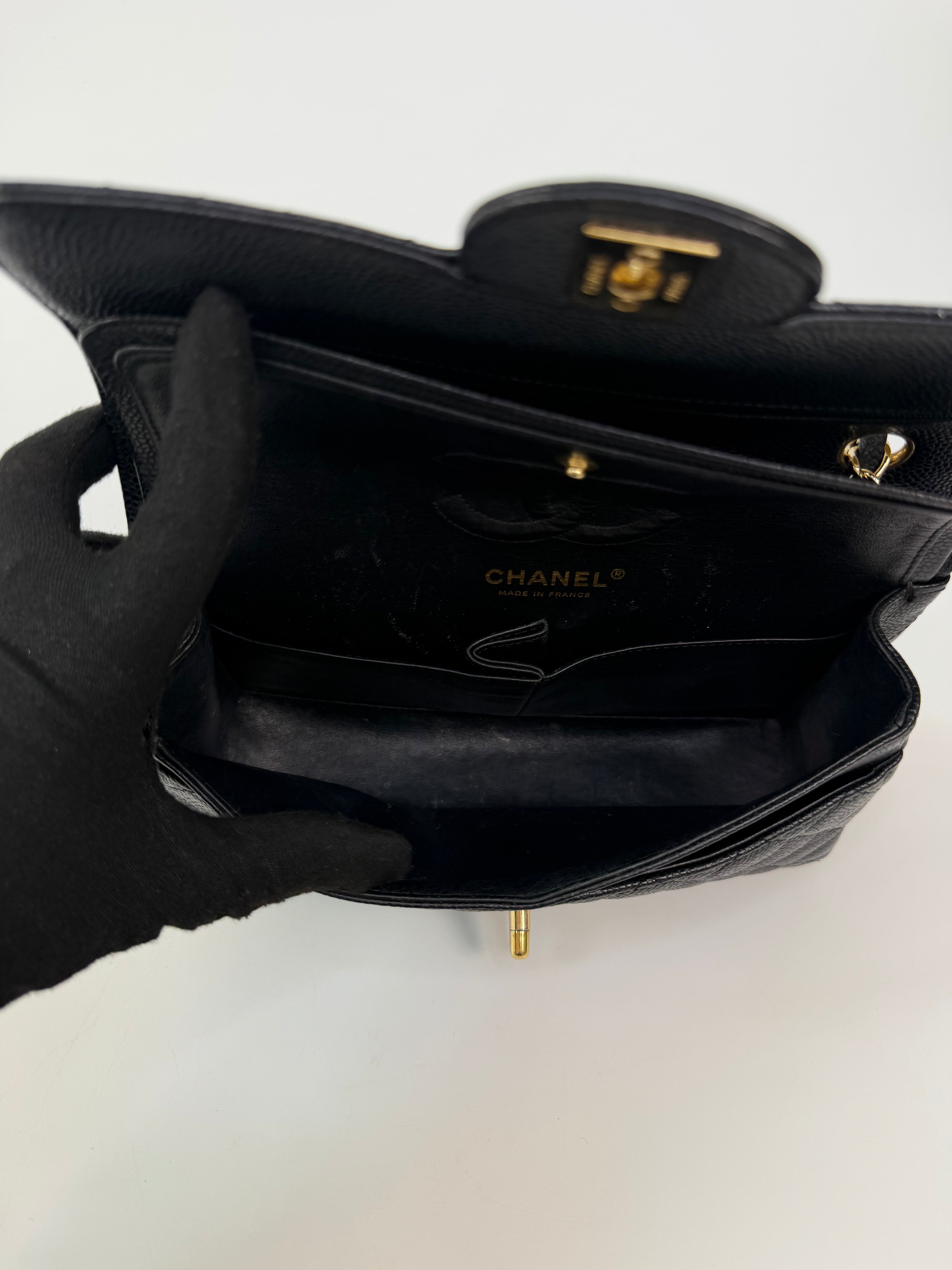 Chanel Small Classic Double Flap In Black Caviar Leather With Gold Hardware. 100% authentic and preloved in excellent condition