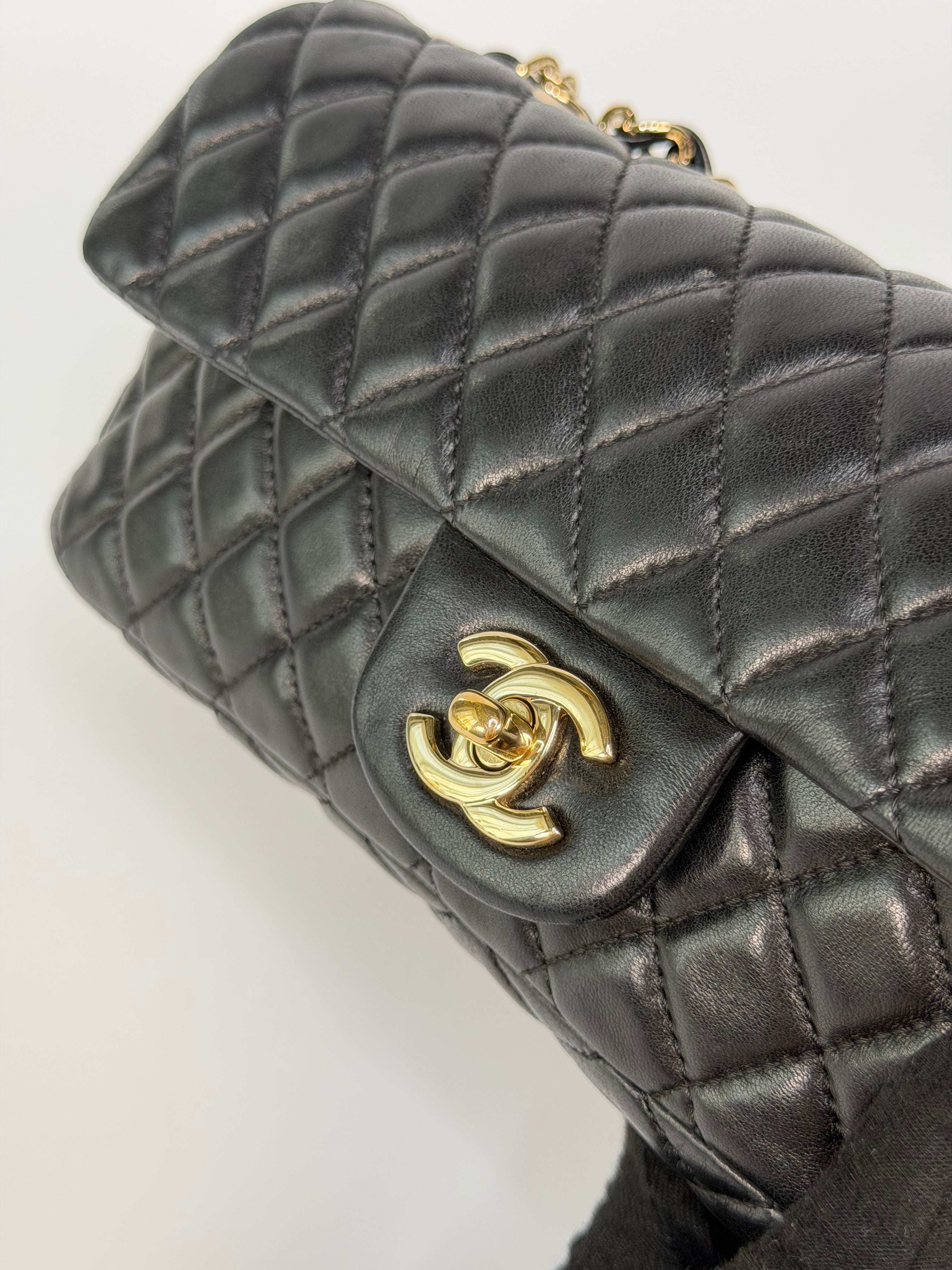 Chanel East West Charms Bag In Black Lambskin Leather With Gold Hardware. Authentic and preloved in excellent condition. 100% guarantee