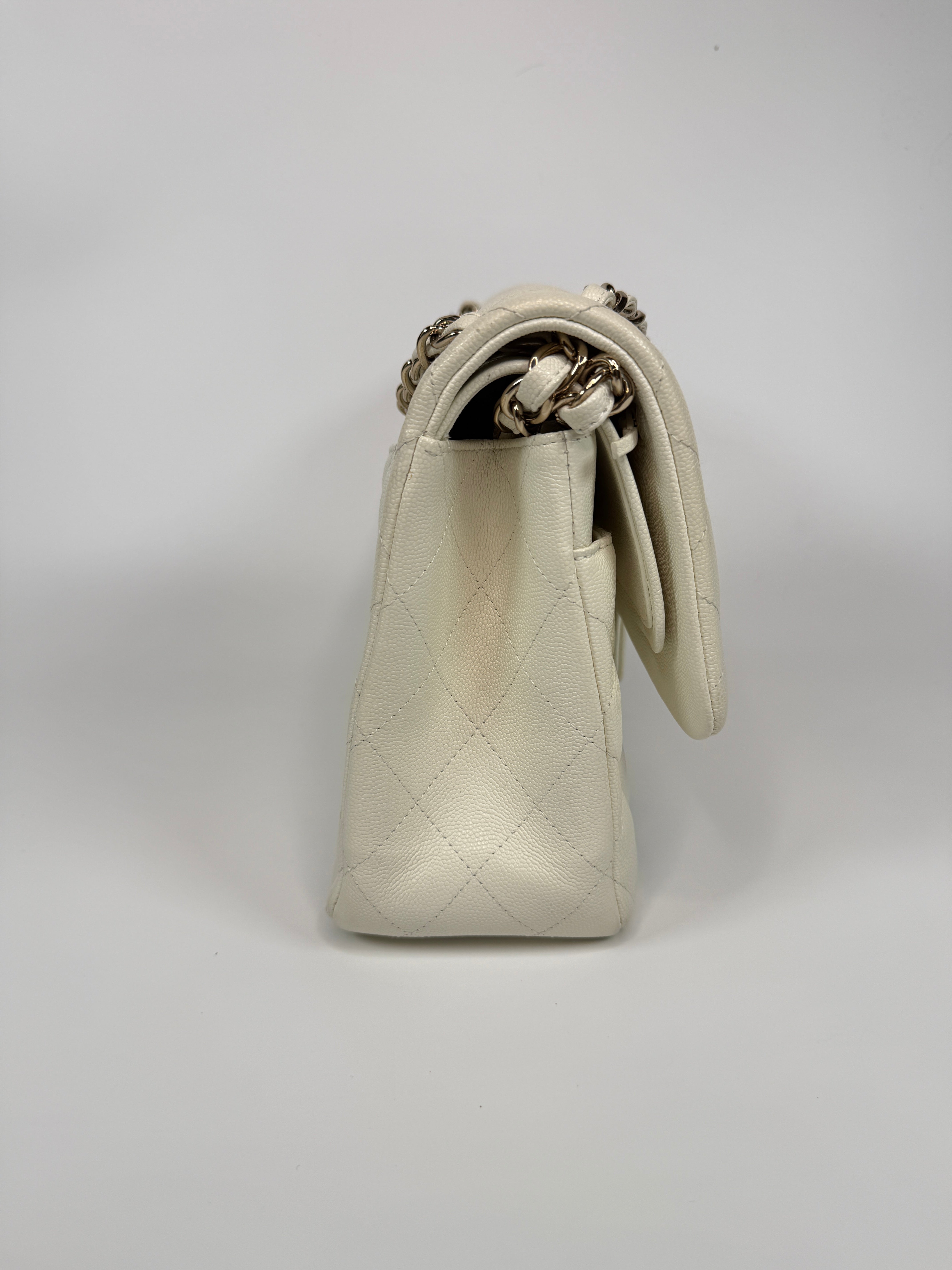 Authentic pre-loved Chanel Classic Jumbo Flap Bag In White Caviar Leather With pale gold  hardware in very good condition. Verified by Luxe Cheshire. International, fast  and fully insured delivery. Trusted designer resale.