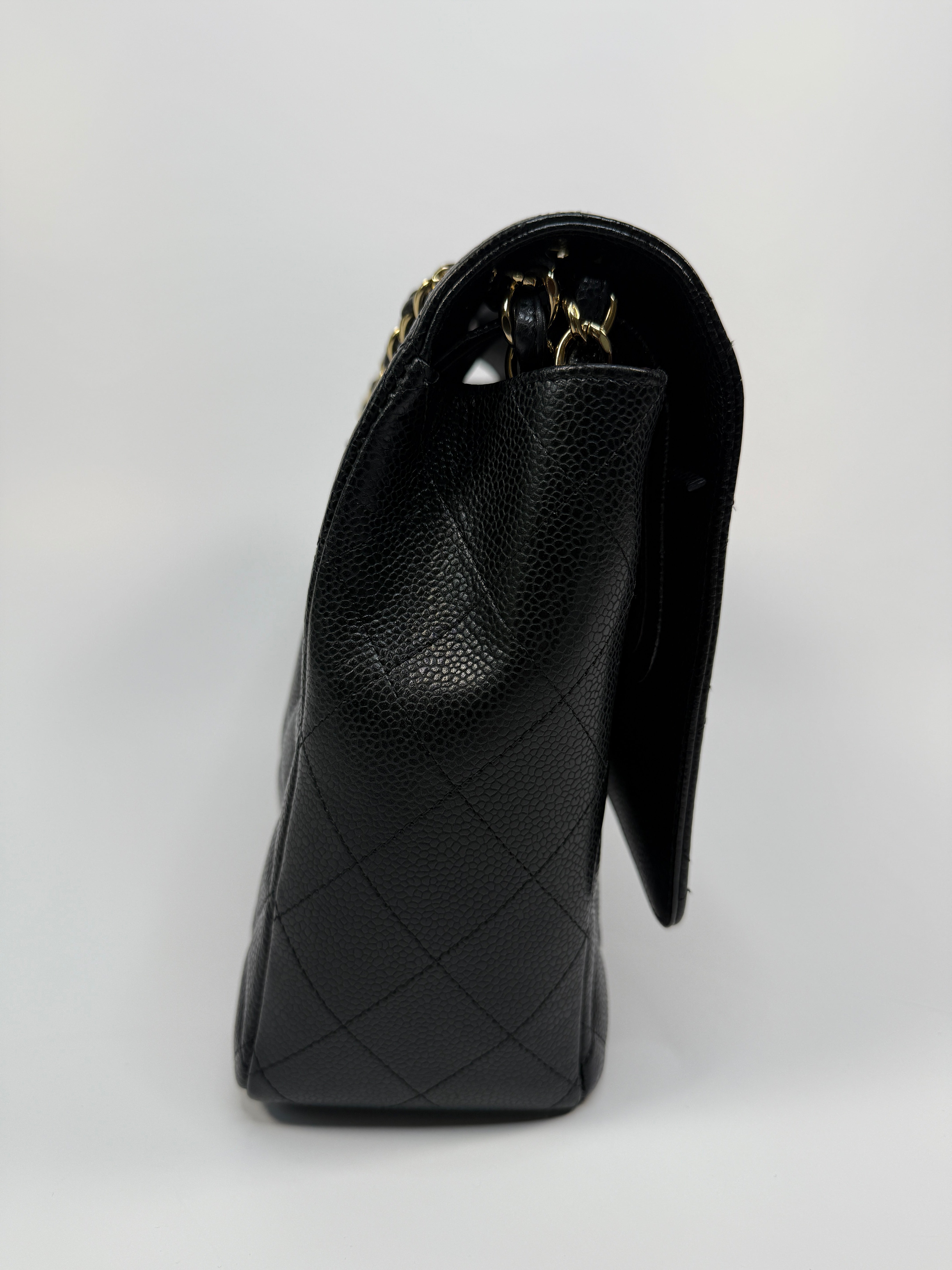 Chanel Maxi Classic Double Flap In Black Caviar Leather With Gold Hardware
Pre Loved & Authentic 