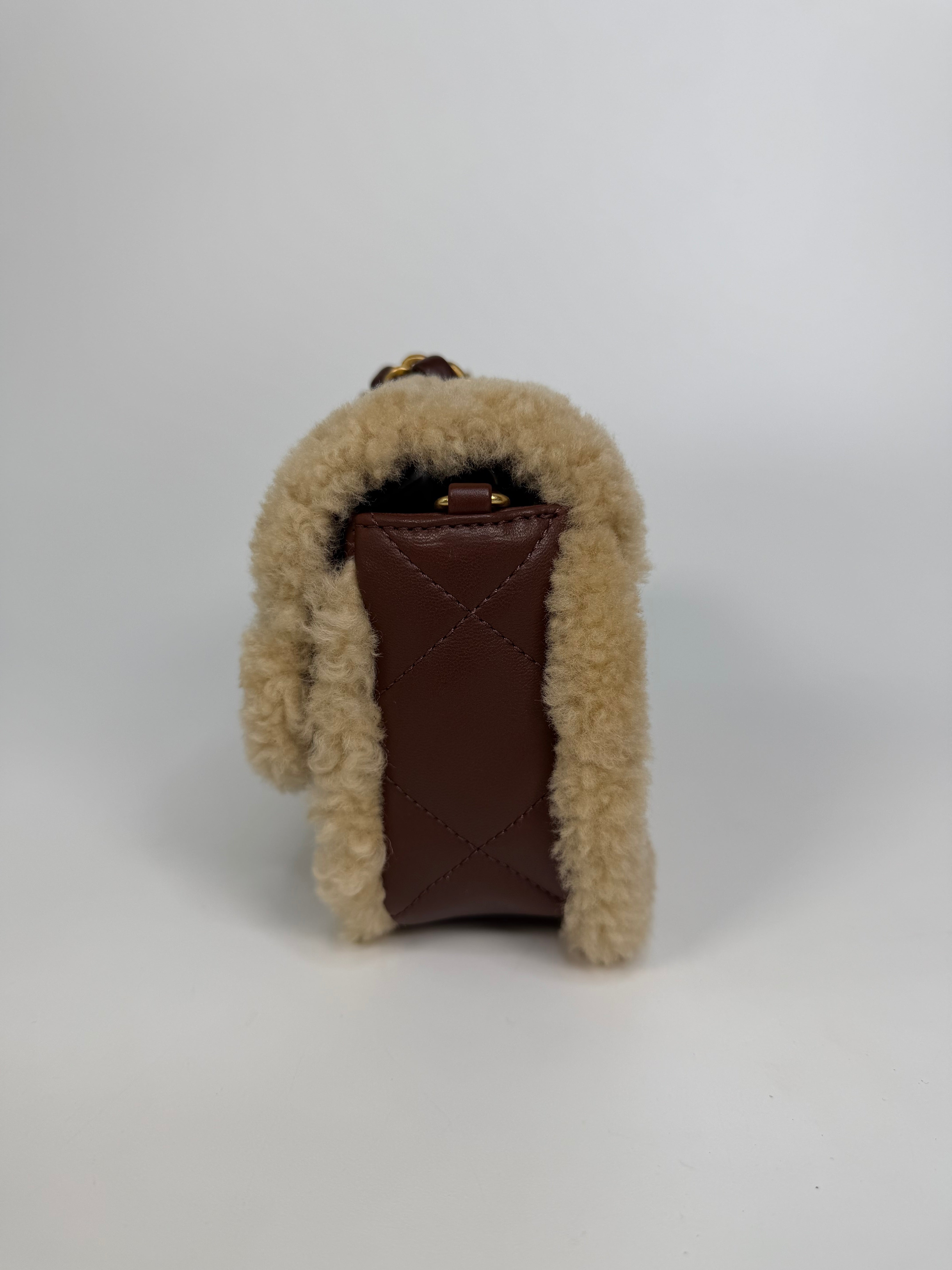 Chanel Mini Rectangle In Brown Lambskin Leather & Shearling With Gold Hardware. Authentic and preloved in excellent condition with 100% authenticity guarantee.