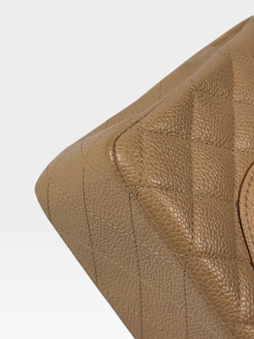 Chanel Medium Classic Flap In Beige Caviar Leather With Gold Hardware. 100% authentic and preloved in excellent condition