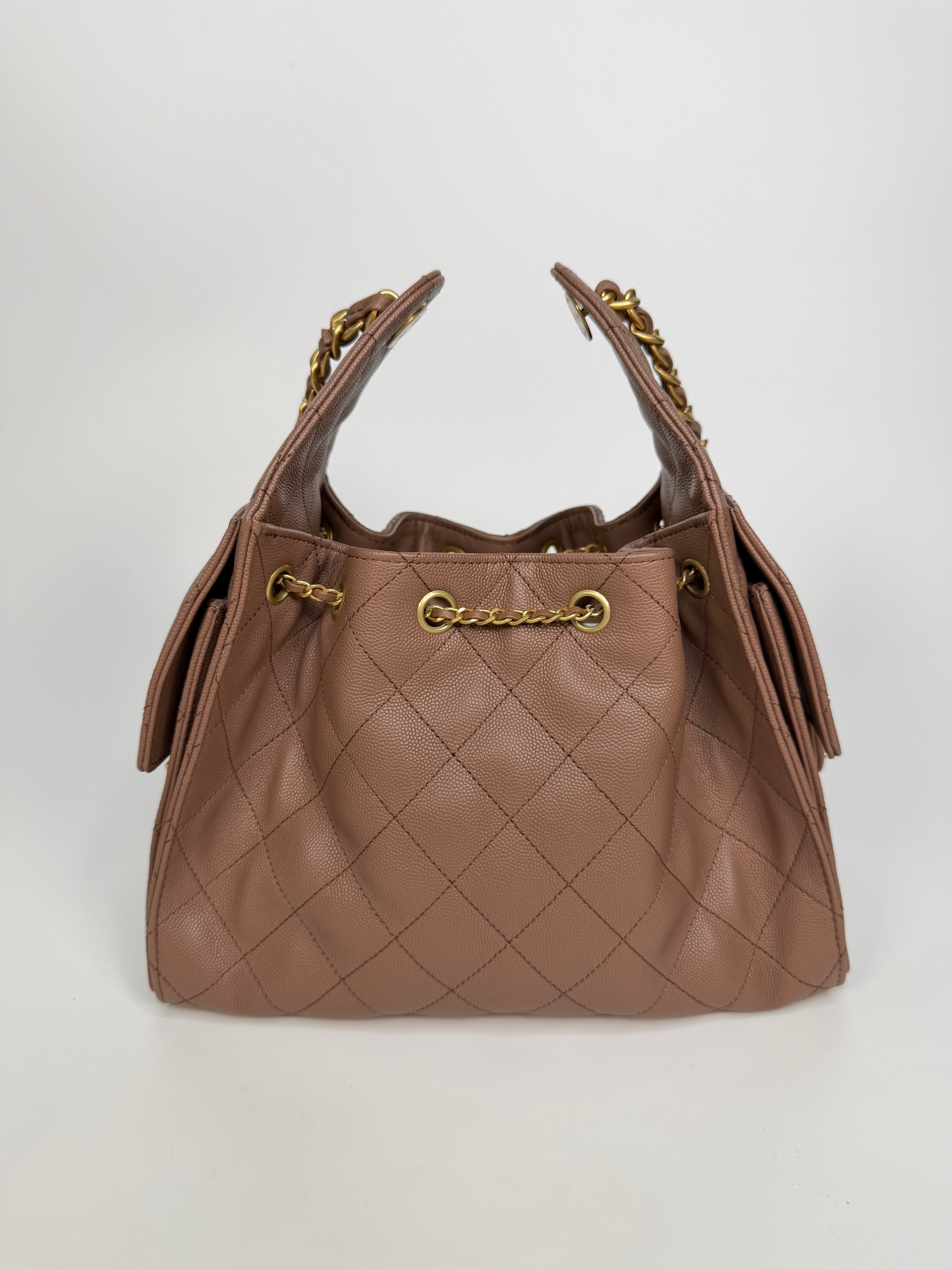 Chanel 25 Small In Brown Caviar Leather With Gold Hardware. Authentic and preloved in excellent condition