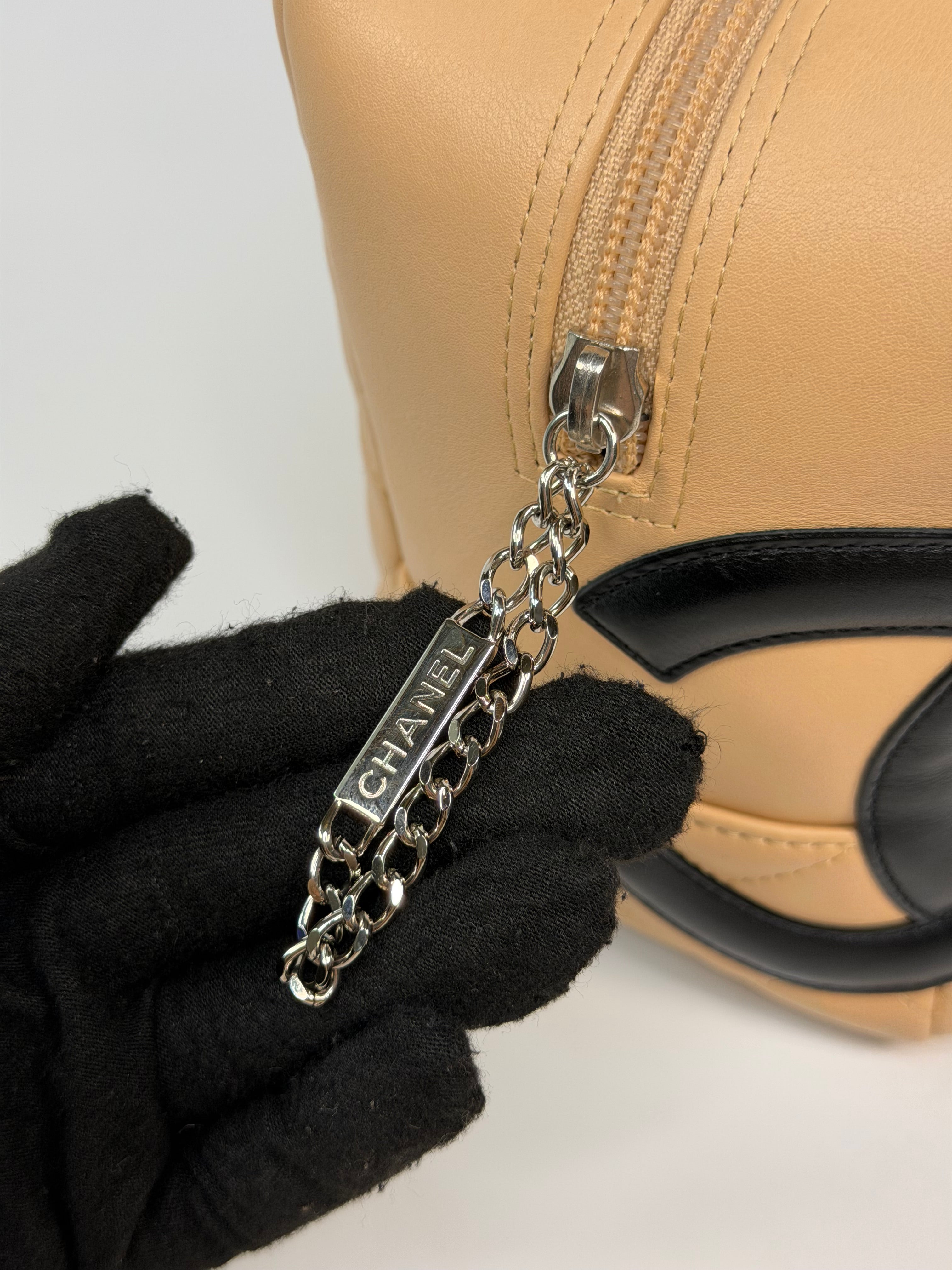 Chanel Cambon Bowling Bag In Beige / Black Leather With Silver Hardware. Authentic and preloved in excellent condition.