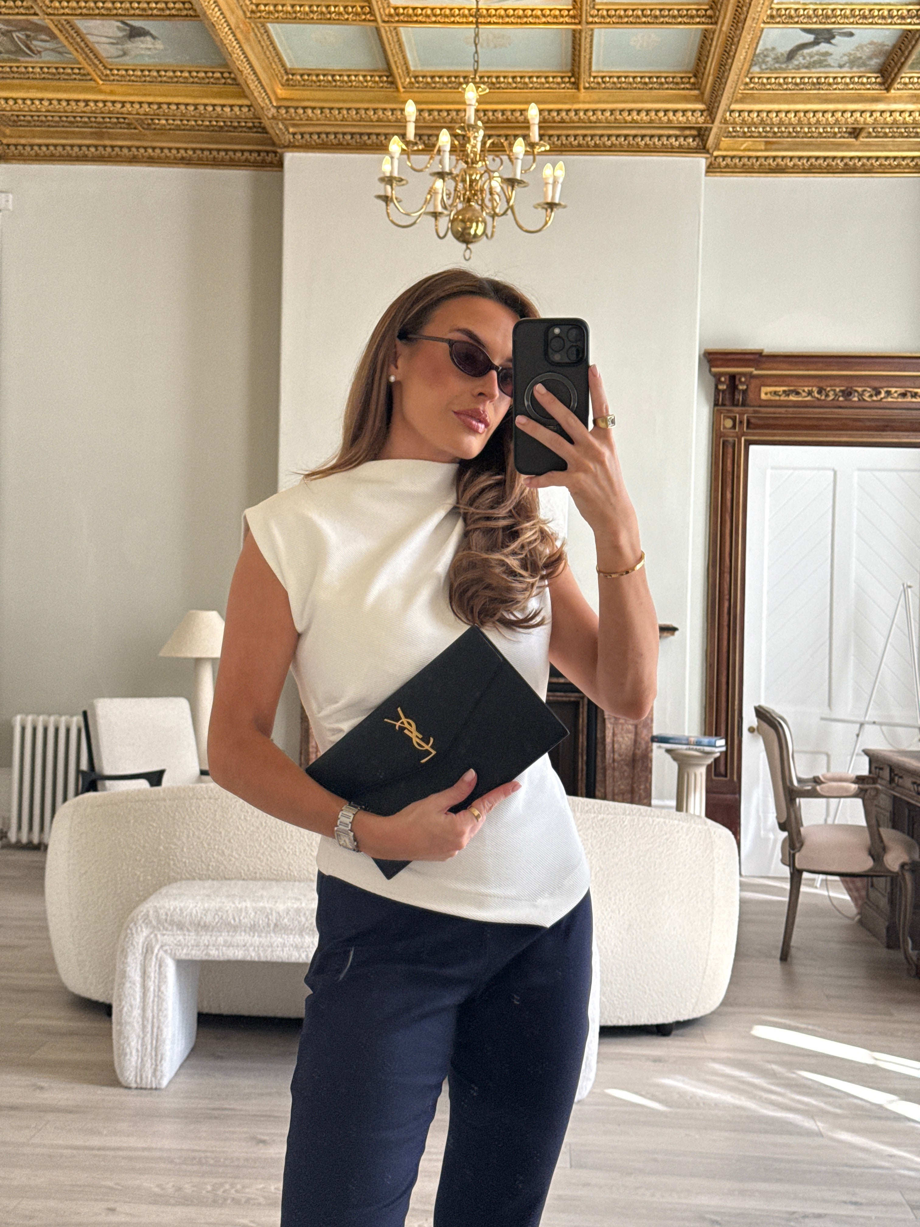 Saint Laurent Uptown Clutch In Black Leather With Gold Hardware. Authentic and preloved, 100% authenticity guarantee 