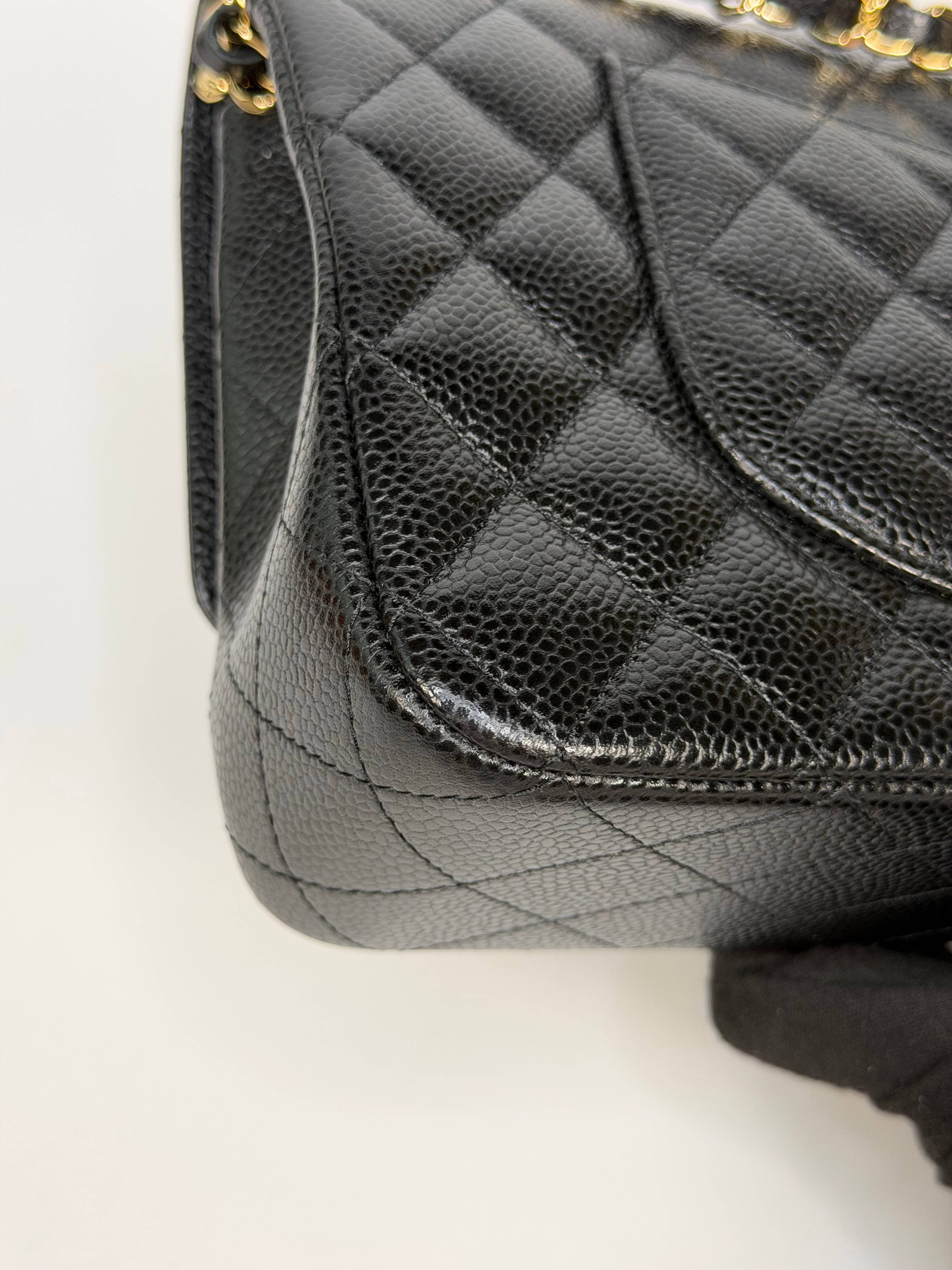 Chanel Medium Classic Double Flap In Black Caviar With Gold Hardware. Authentic and preloved in new and unused condition. 