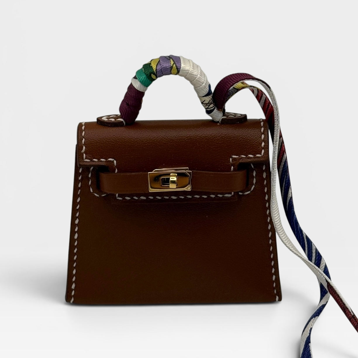 Hermès Kelly Twilly Charm In Gold Tadelakt Leather With Gold Hardware