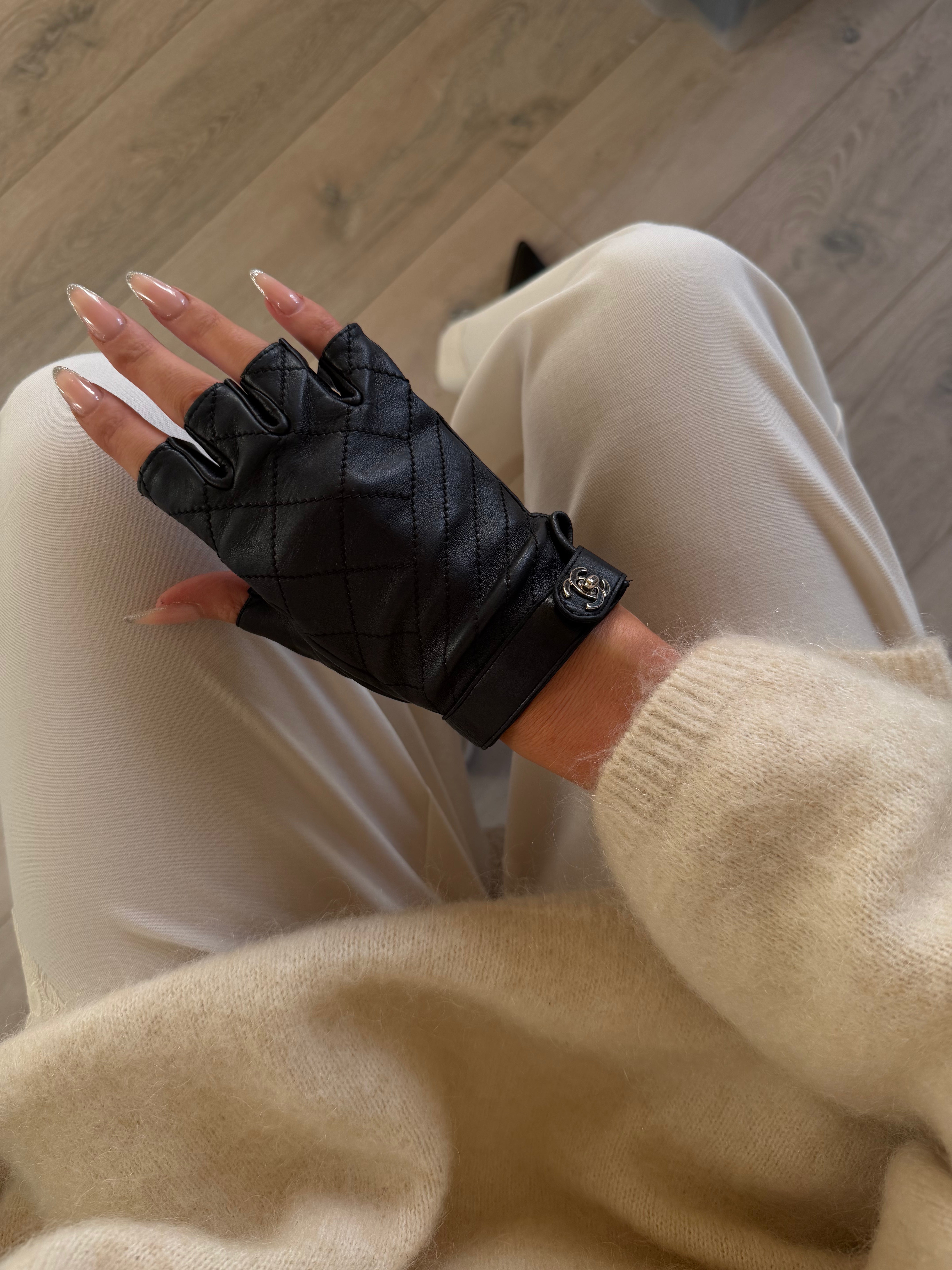 Chanel Black Leather Fingerless Gloves Excellent condition. Authentic and preloved. 