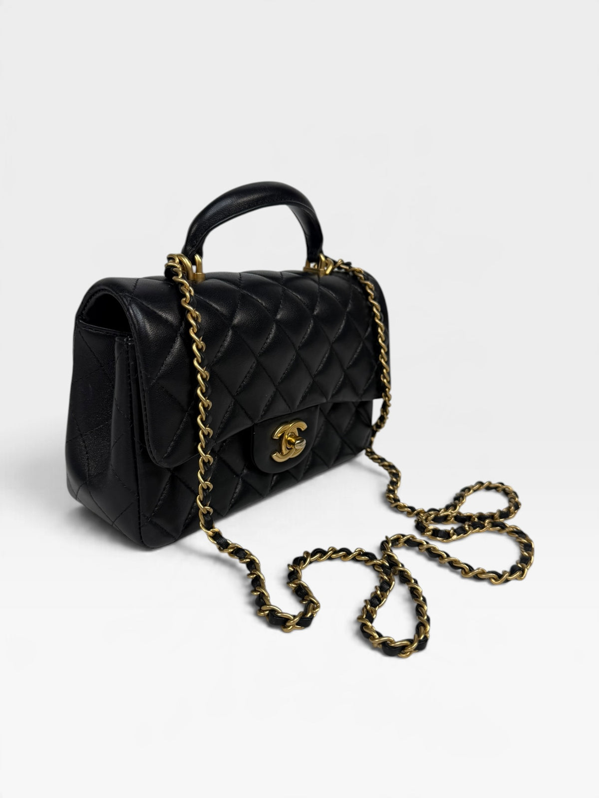 Chanel Mini Rectangle Top Handle In Black Lambskin With Gold Hardware. 100% authentic and pre loved in excellent condition. 