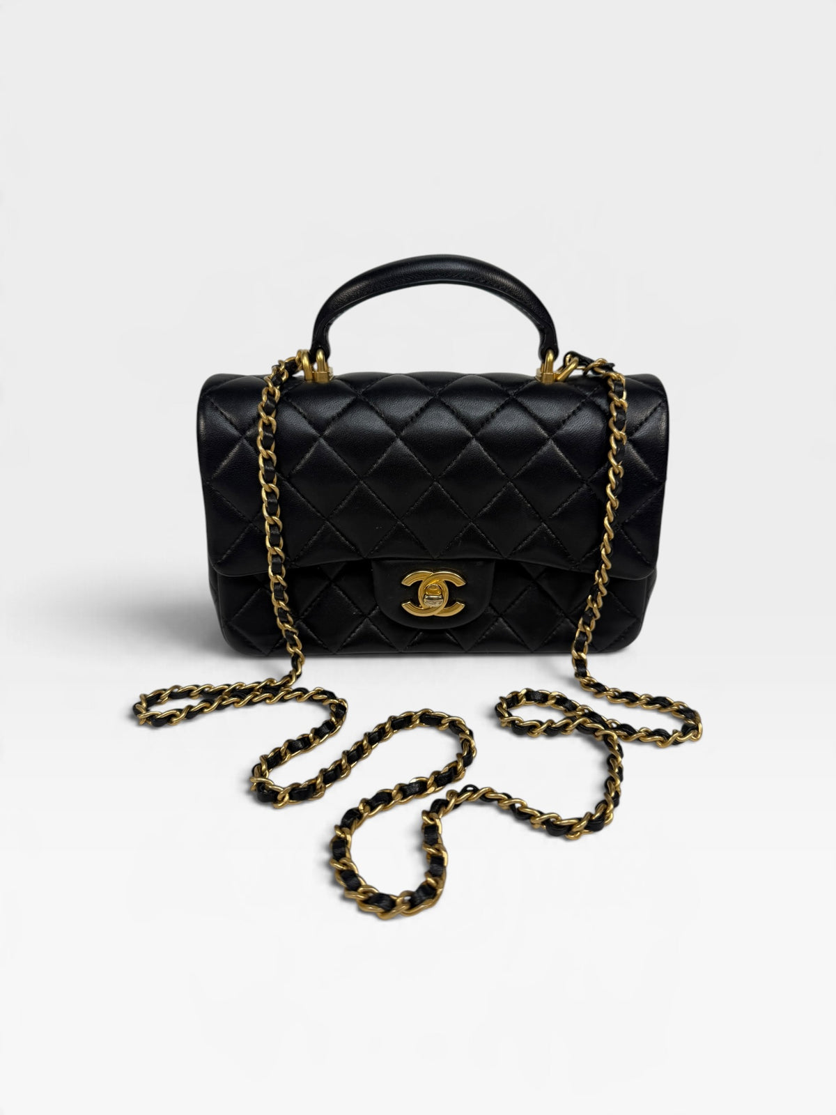 Chanel Mini Rectangle Top Handle In Black Lambskin With Gold Hardware. 100% authentic and pre loved in excellent condition. 