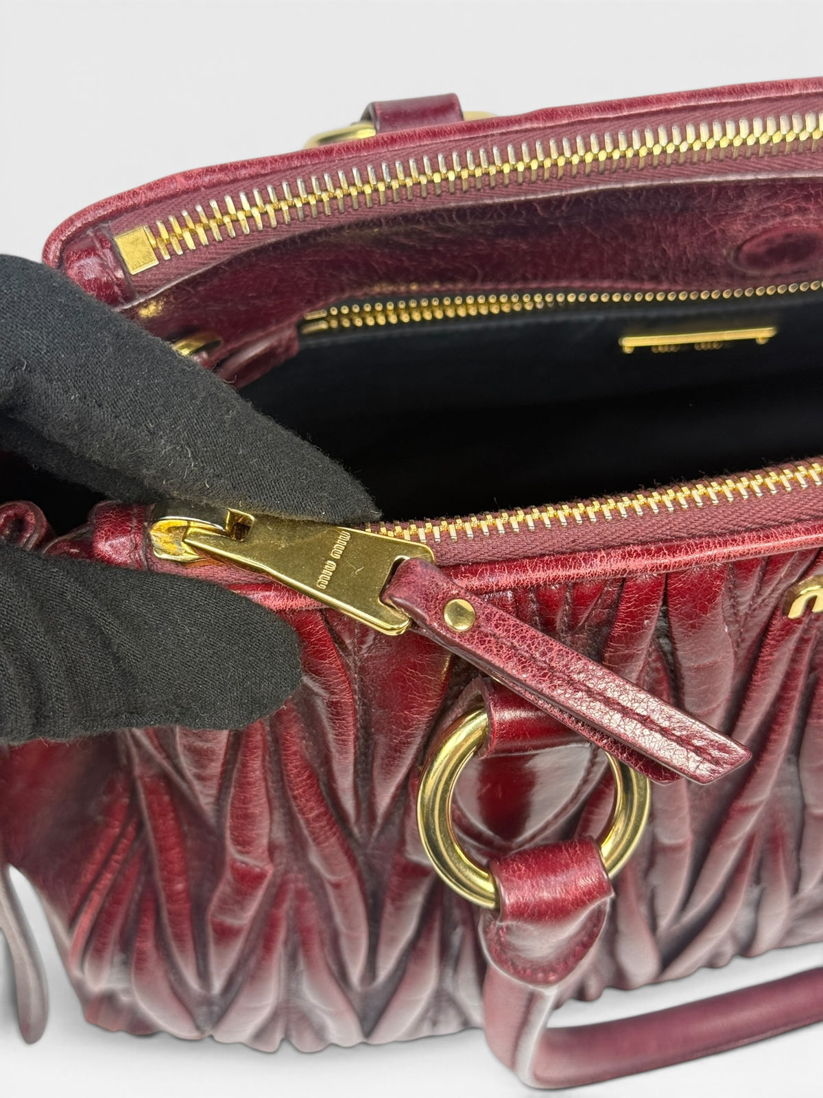 Miu Miu Bauletto Tote Bag In Burgundy Matelasse Leather With Gold Hardware. 100% authentic and pre loved in excellent condition. 
