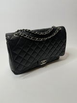 Chanel Maxi Classic Double Flap In Black Caviar Leather With Silver Hardware
