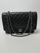 Chanel Maxi Classic Double Flap In Black Caviar Leather With Silver Hardware